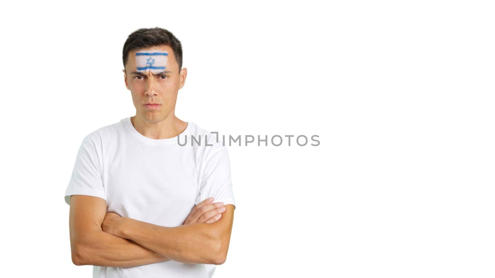 Dignified and serious man with israeli flag painted on face looking the camera with dignity