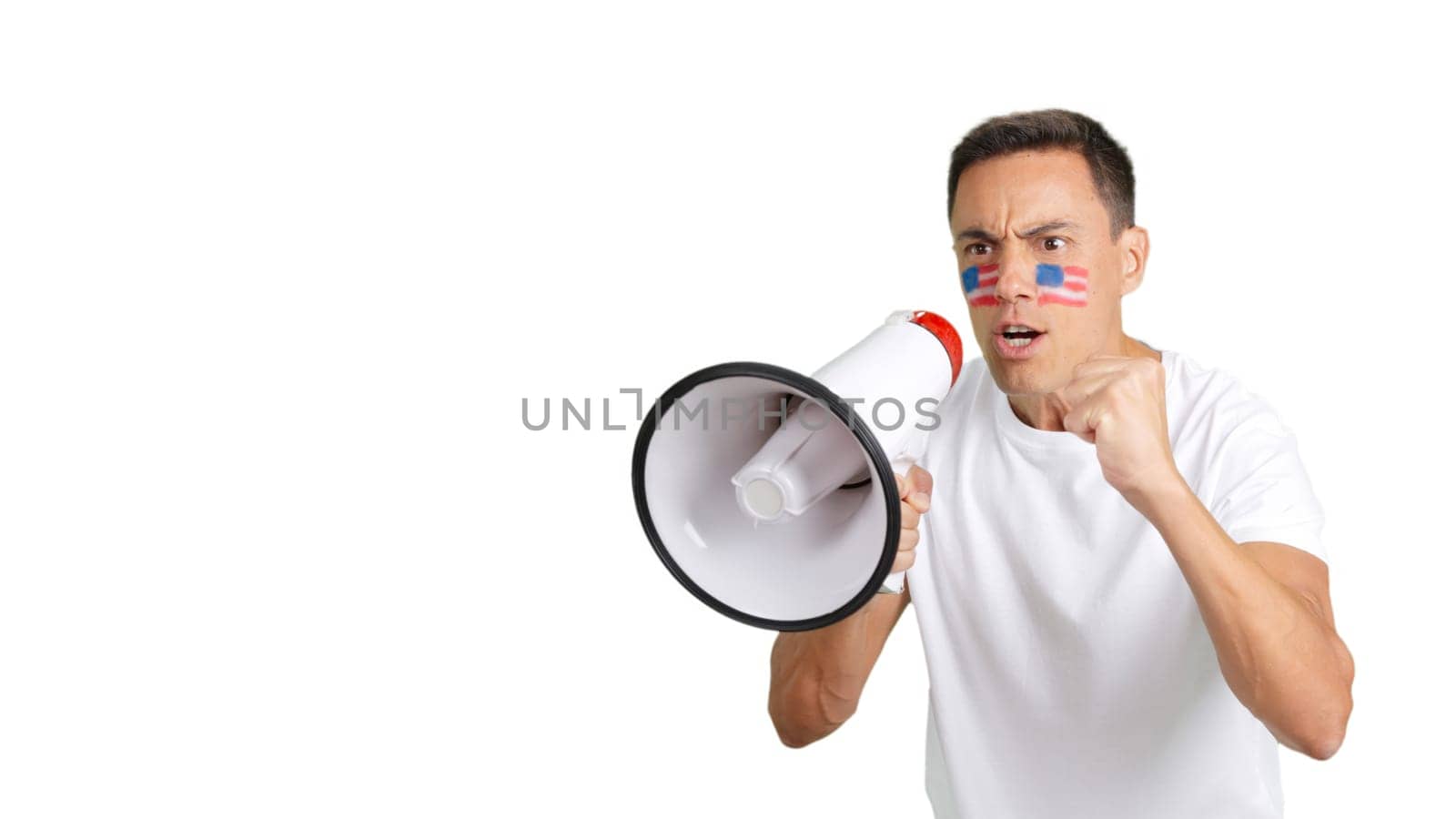 Man with a USA flag painted on his face rallying the crowds using a megaphone
