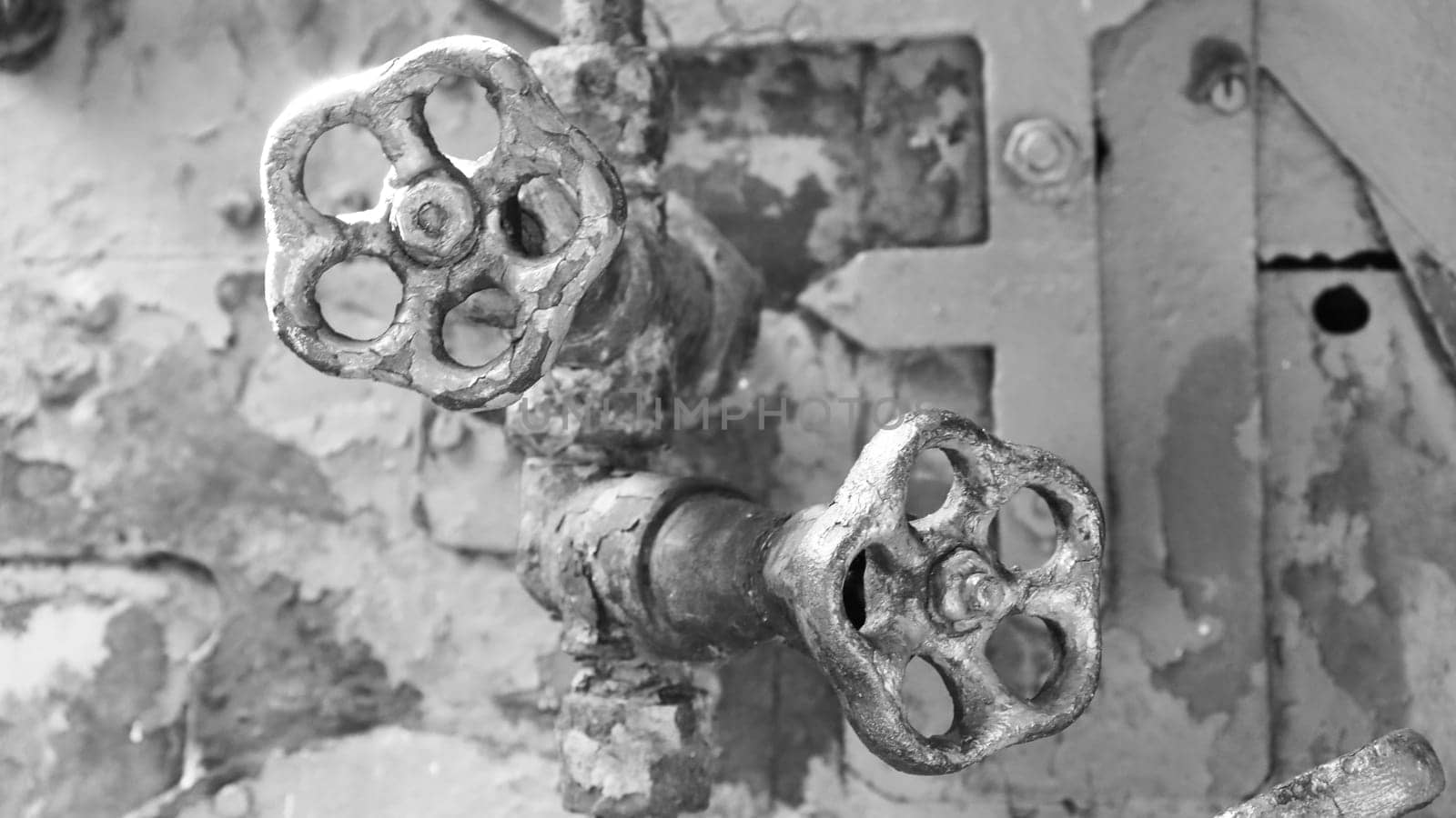 Steam engine controls...Two sulfur shabby retro taps for shutting off the water close-up.
