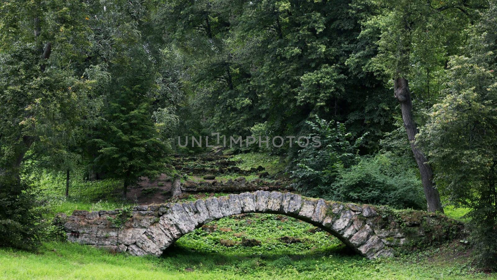 Stone bridge in a suburban historical park.