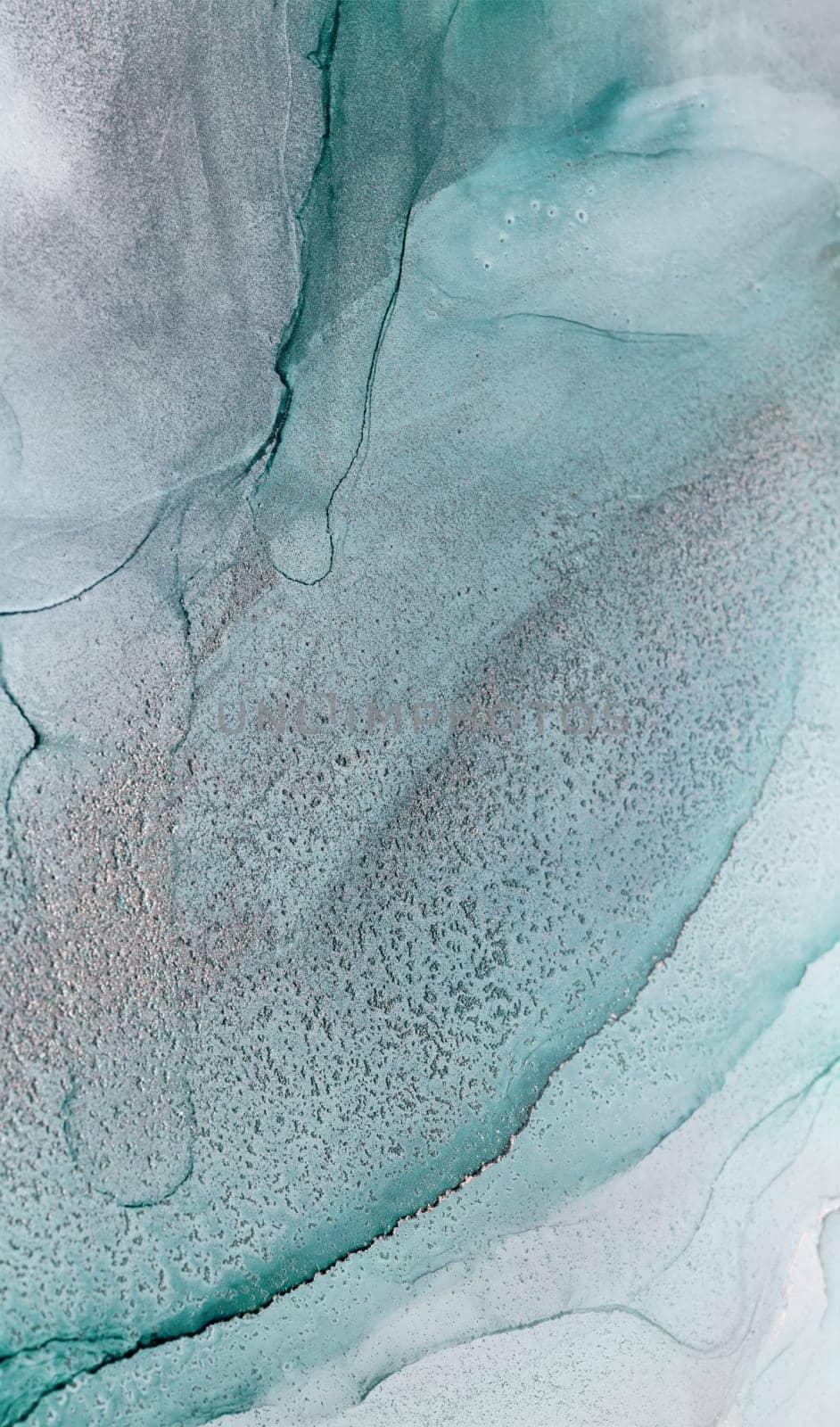 An abstract photograph of teal and white ink swirling together, creating a mesmerizing and organic pattern. The colors blend seamlessly, creating a sense of depth and movement.