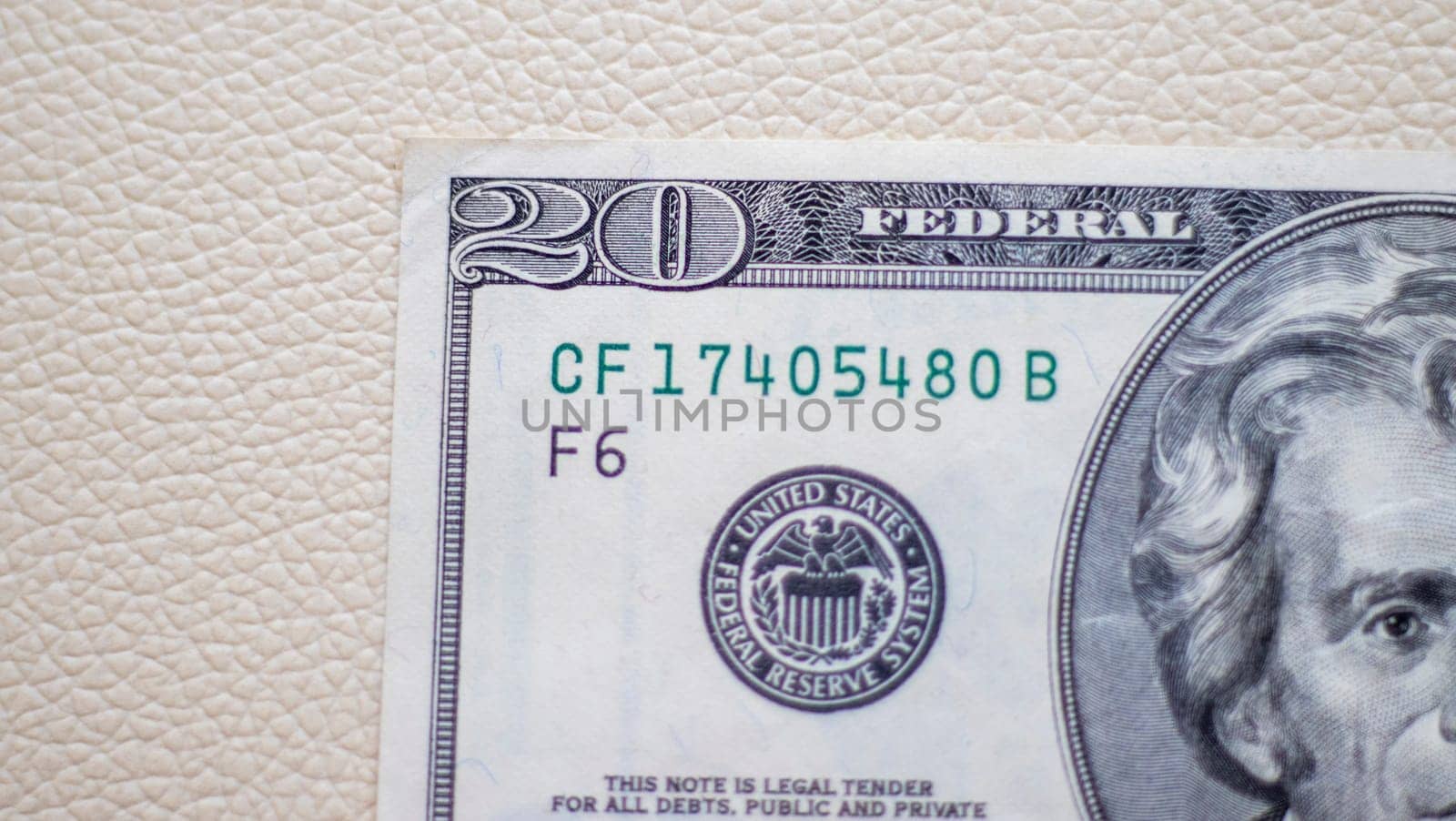 Close up shot of the US dollars note bill on the white leather background