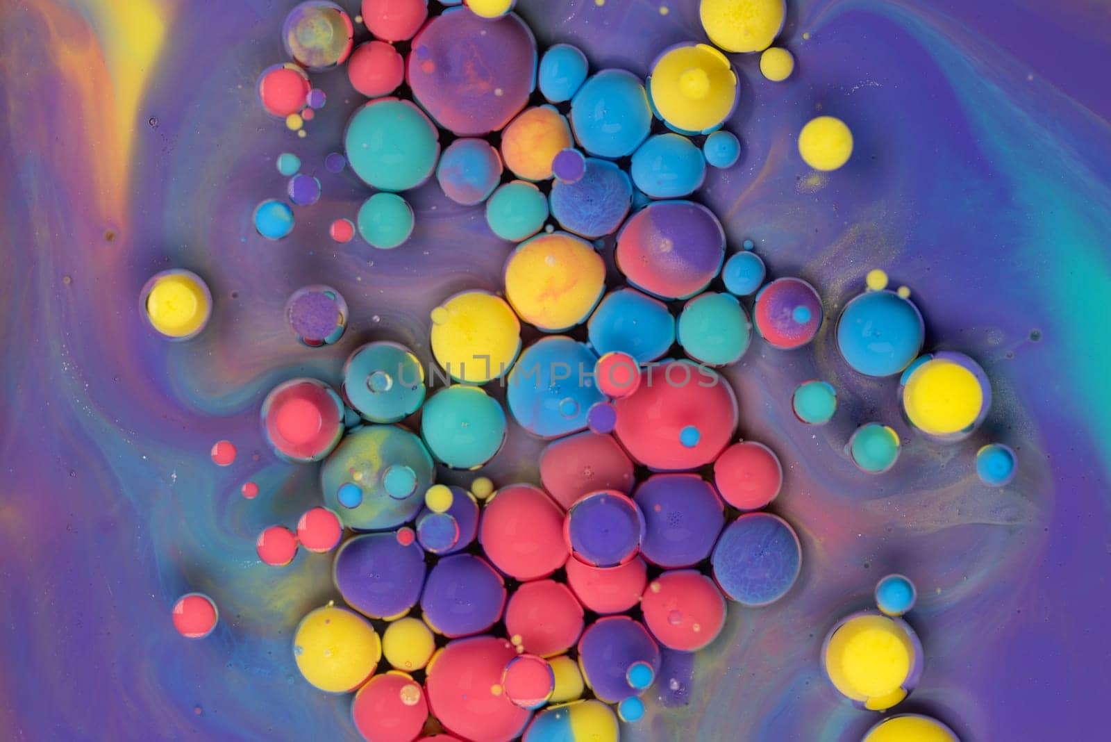 A Symphony of Spheres in Lavender HA close-up shot of vibrant, colorful spheres suspended in a lavender liquid, creating a mesmerizing abstract pattern.ues. High quality photo