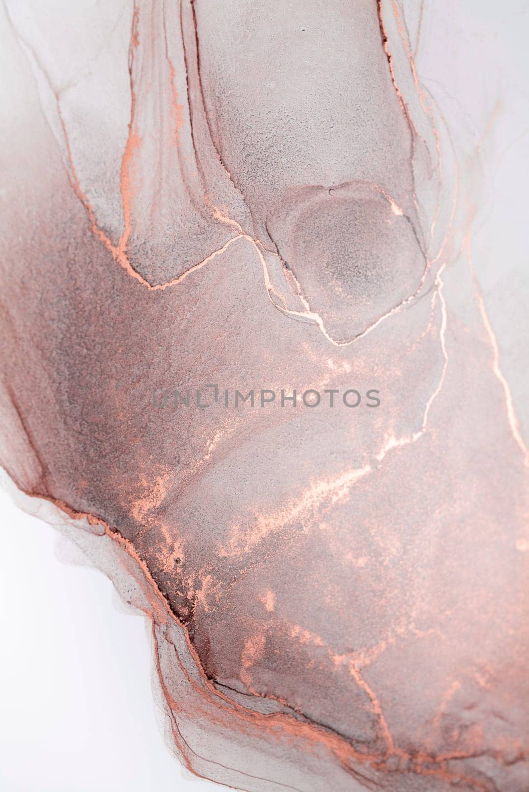 A close-up image of an abstract art piece featuring swirling patterns in shades of rose gold and white.