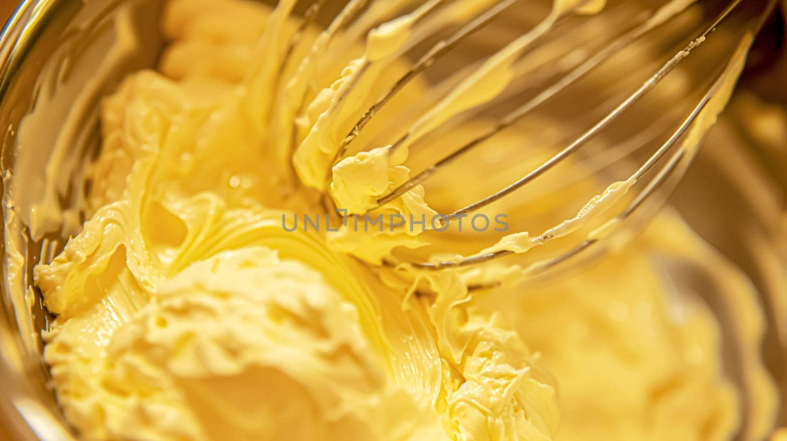 Whisk in bowl with creamy yellow batter, butter or custard, homemade baking and traditional food, country life