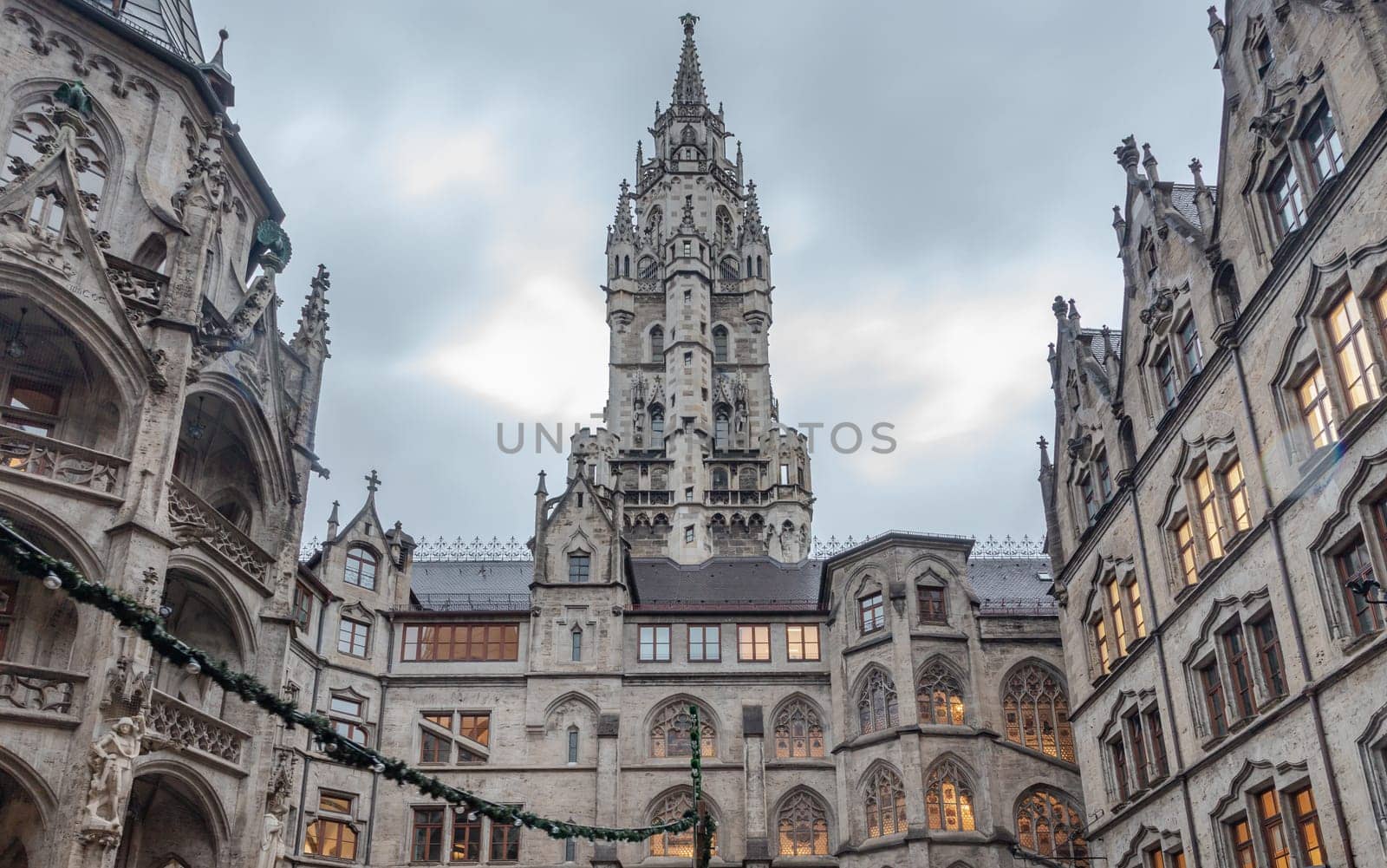 Munich, Germany - Dec 21, 2023 - Exterior architecture of famous New Town Hall (Neue Rathaus) on Marienplatz square in Munich. Gothic architectural style. Upper Bavaria, Space for text, Selective focus.