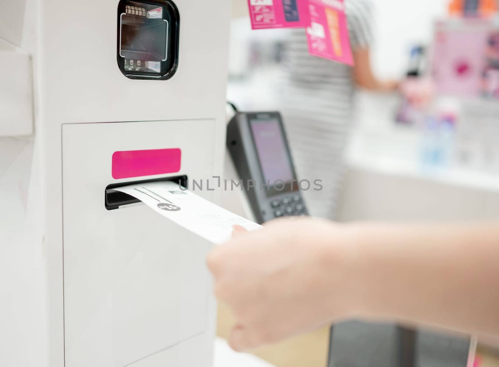 Girl Receives Receipt At Self-Service Checkout Terminal, Close-Up Of Hands