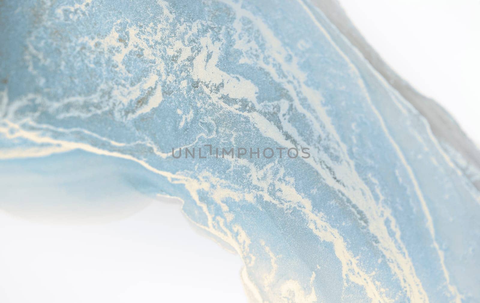 A close-up of a blue and white abstract art piece, with swirling patterns reminiscent of a gentle morning light.