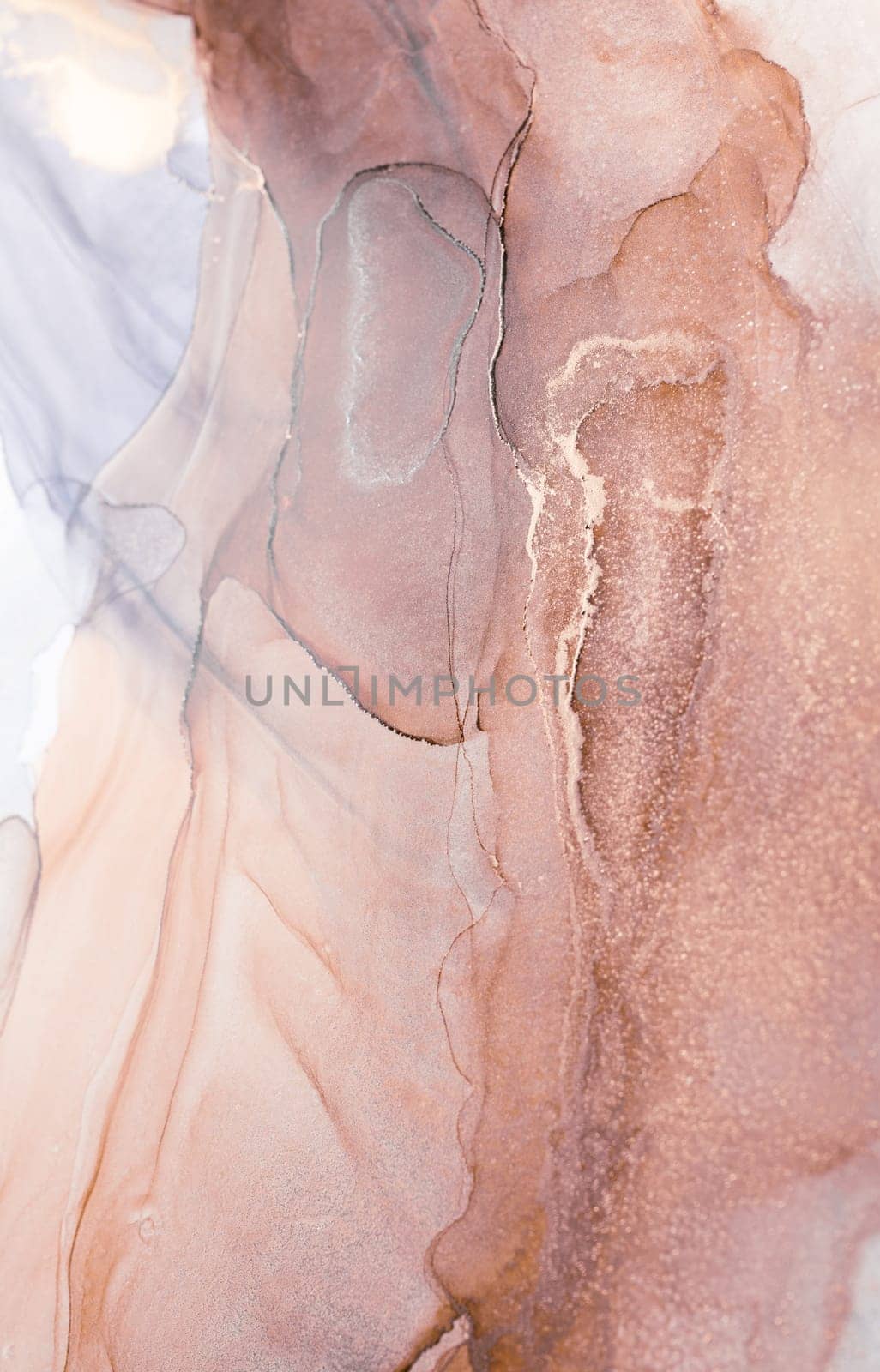A close-up image showcasing a captivating abstract design created with ink. The colors blend seamlessly, creating a mesmerizing visual experience with shades of peach, ivory, and hints of gold.