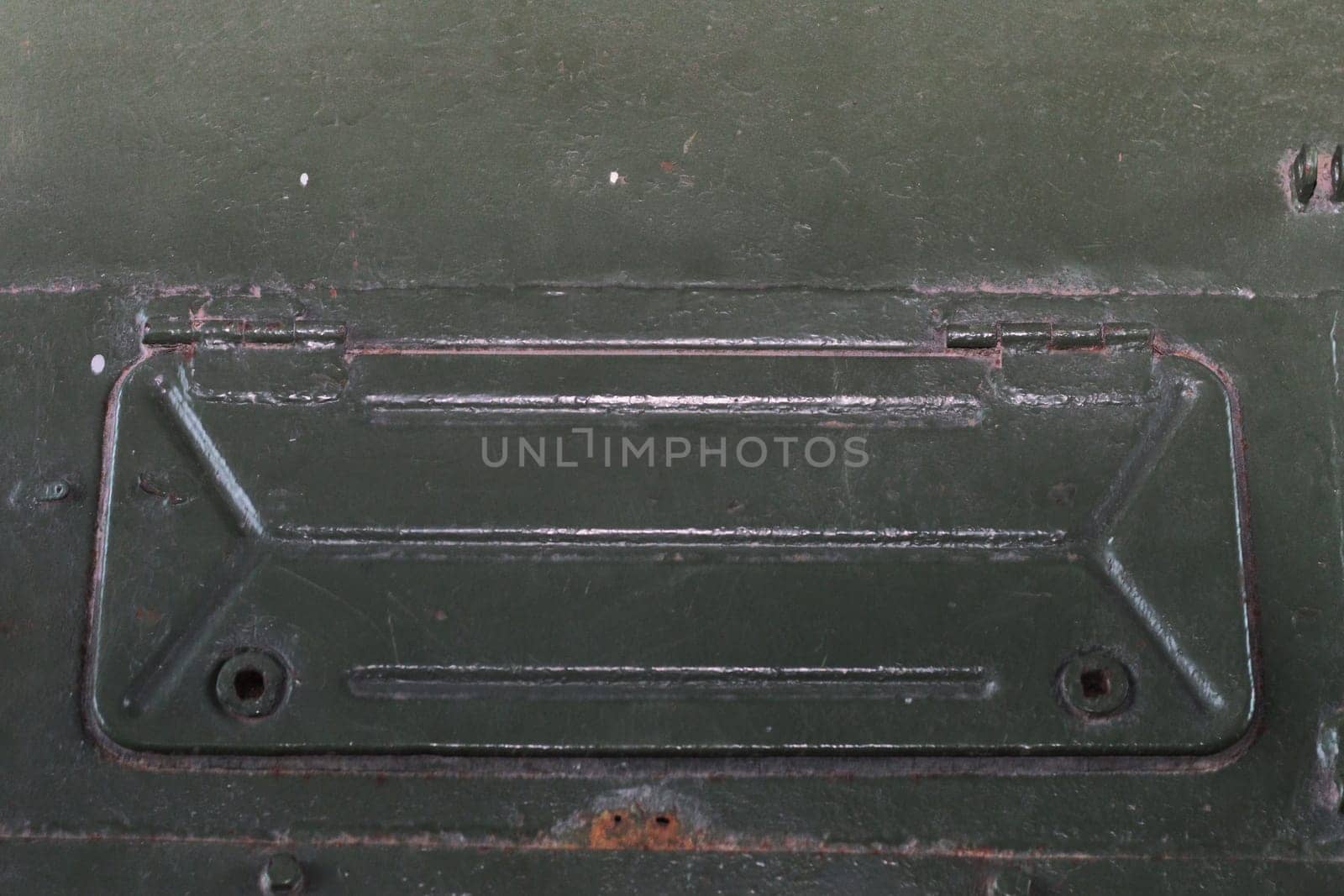 Technical niche with a lid with holes for screws. Tank hatch. Closed window.