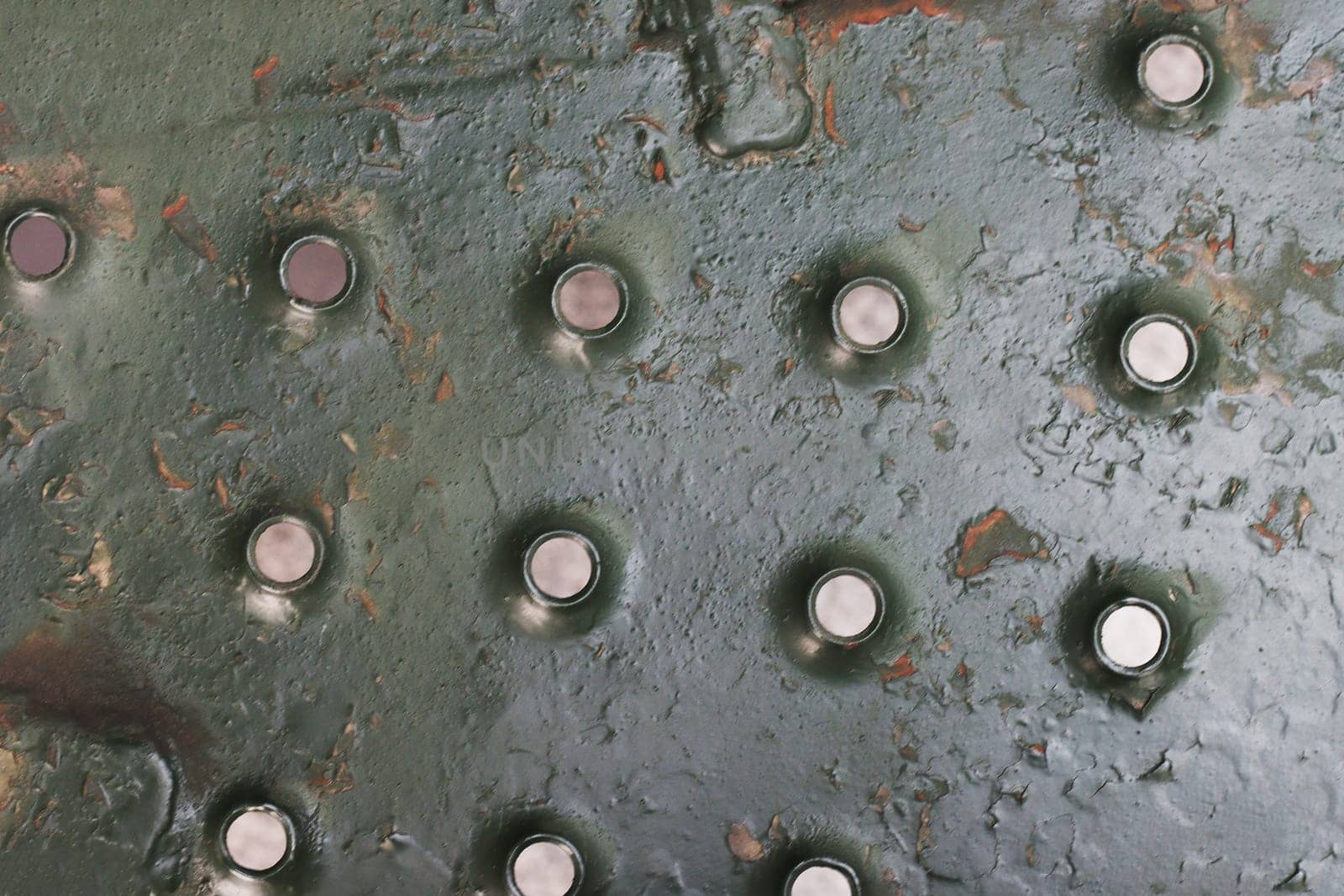 Fragment of a staircase from old military equipment. Metal side.