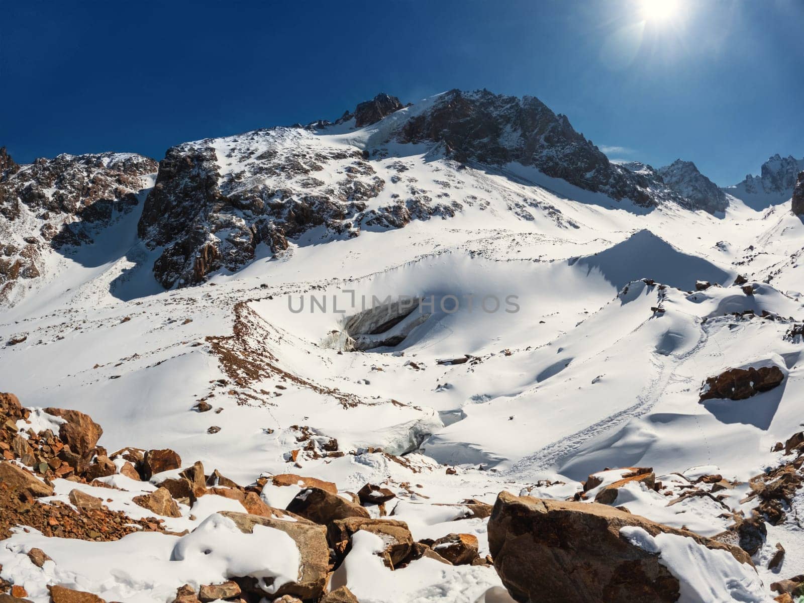 Experience the captivating beauty of Central Asia with the Bogdanovich Glacier in Kazakhstan's Almaty Mountains, nestled within the scenic Ile Alatau National Natural Park.