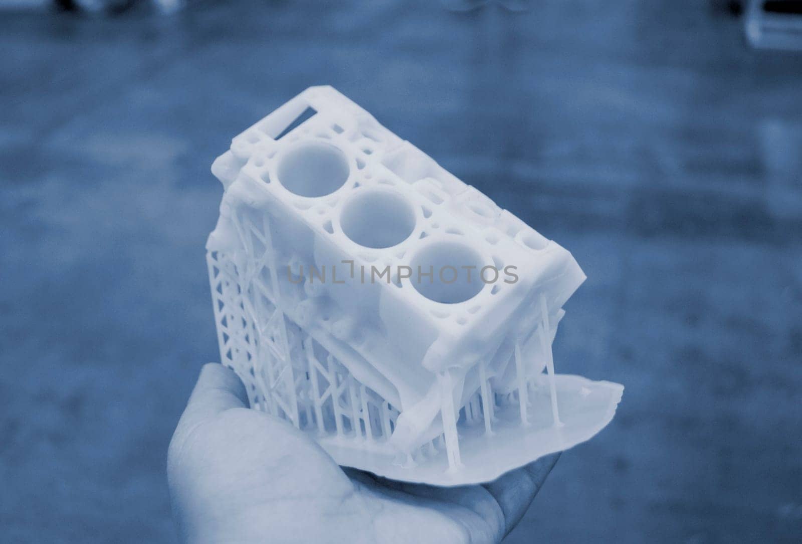 Detailed models in form of internal combustion engine printed on 3D printer from polymer close-up. Detailed object created by 3D printer using 3D printing method. Concept 3D Printing. SLA technology