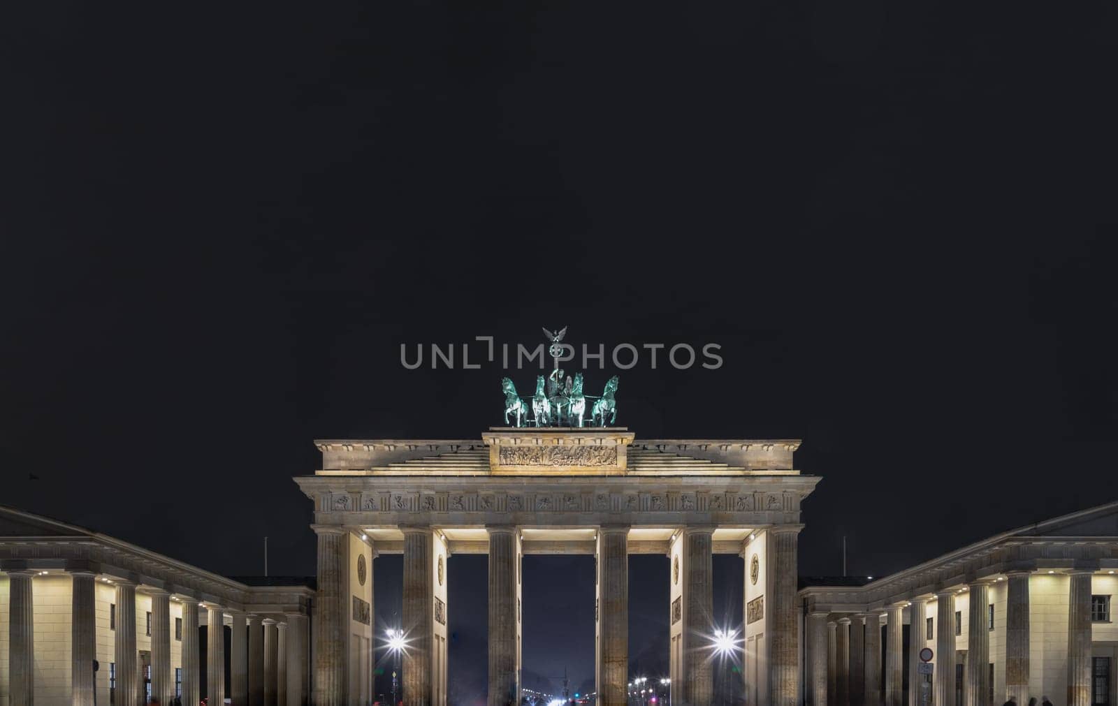 Berlin, Germany - Dec 19, 2023 - Night view of famous Brandenburger Tor (Brandenburg Gate). one of the best-known landmark and national symbols of Germany, A Tourist attraction and Meeting place, Space for text, Selective focus.