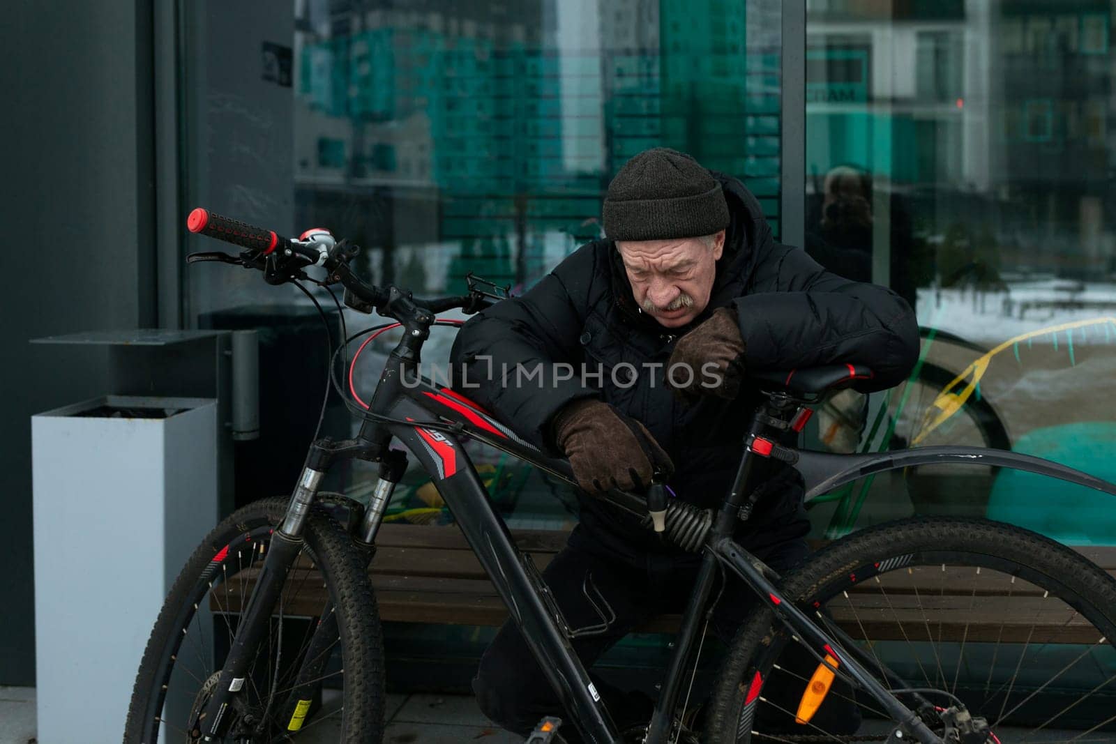 An elderly man went out for a bike ride in winter.