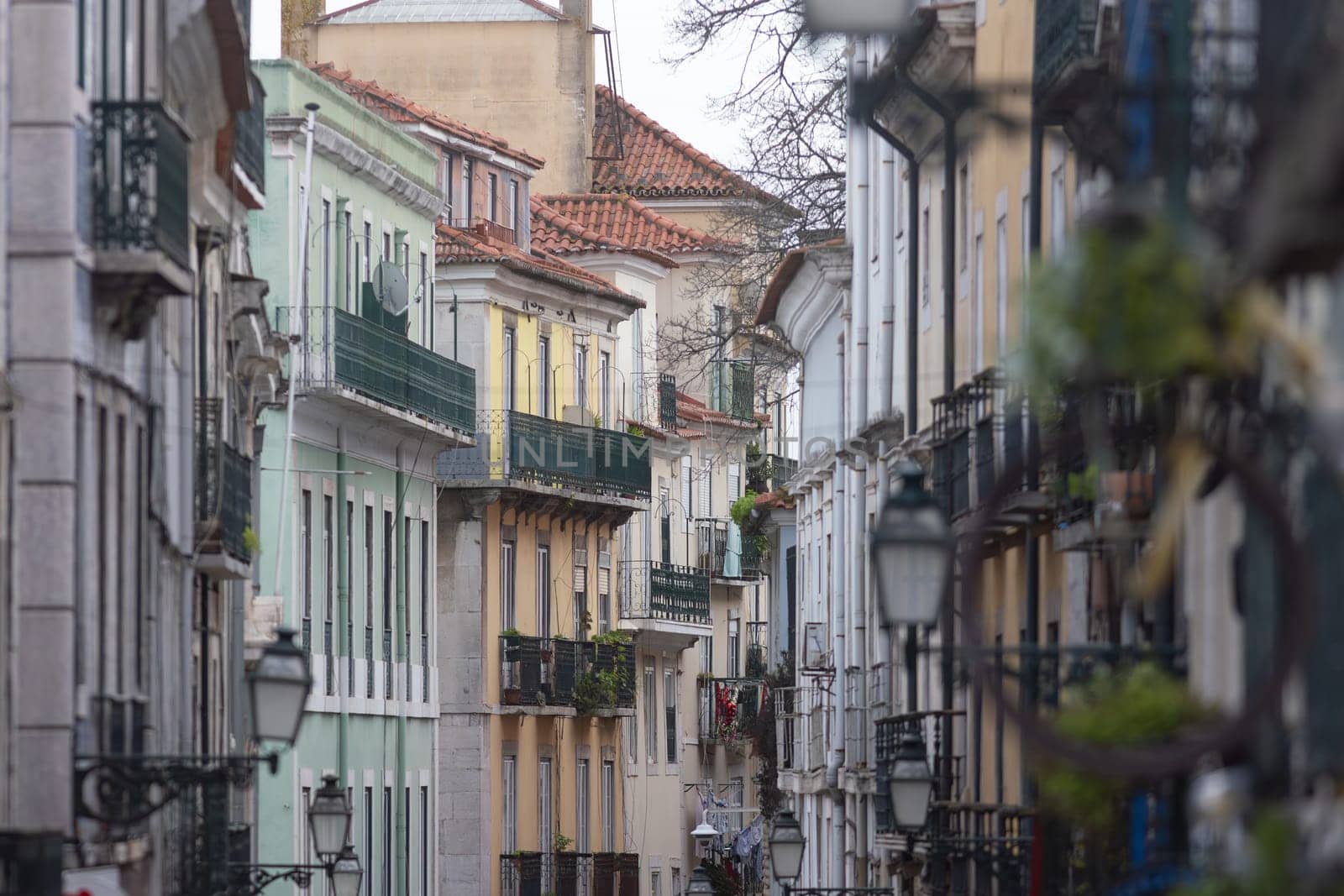 A narrow city street lined with tall buildings