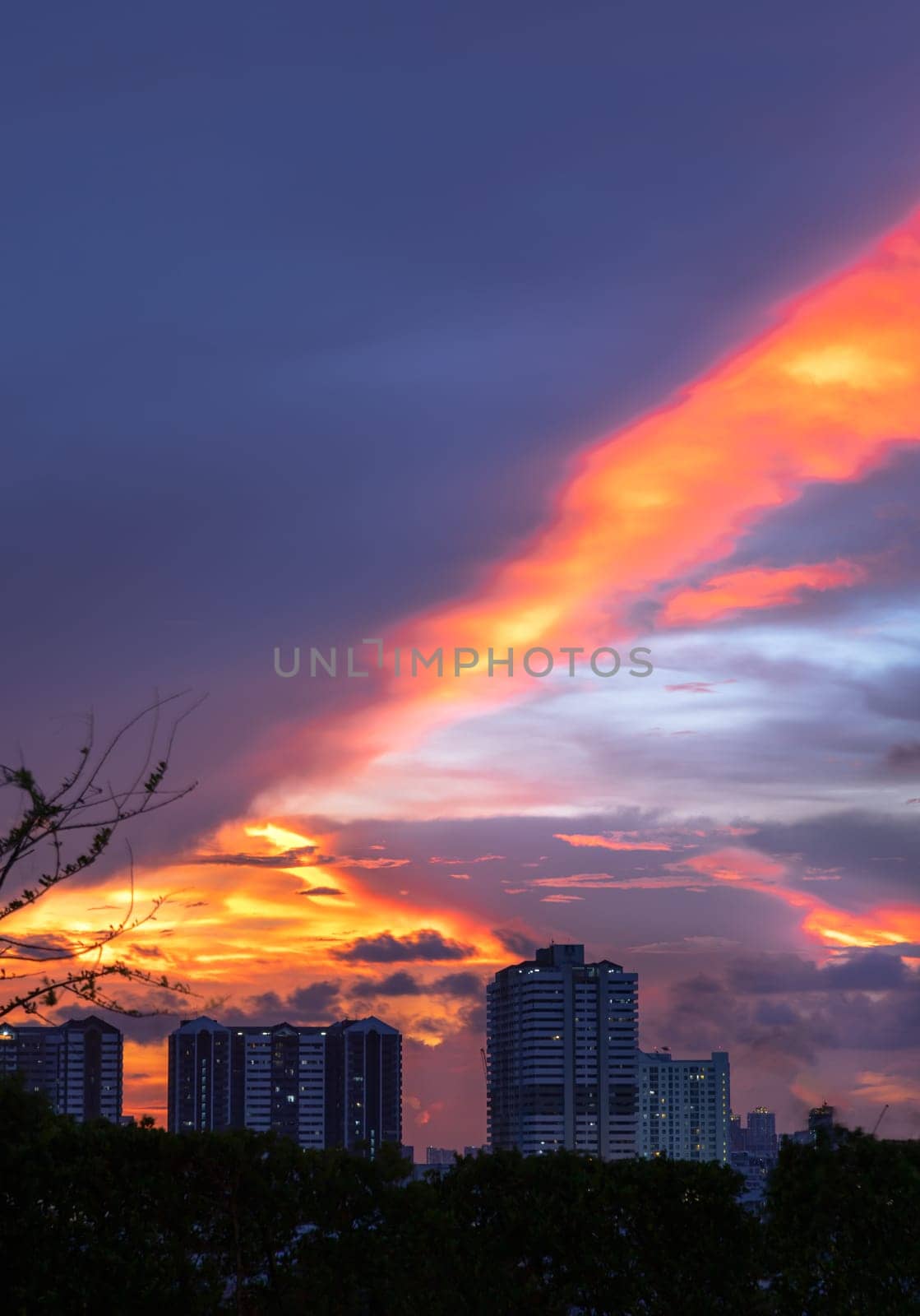 Bangkok, Thailand - May 20, 2024 - Blue, Orange and Yellow sky over cityscape after sunset. Gorgeous scenic of city on sunset with beautiful cloud and sky, They can be used as Wallpaper, Space for text, Selective Focus.