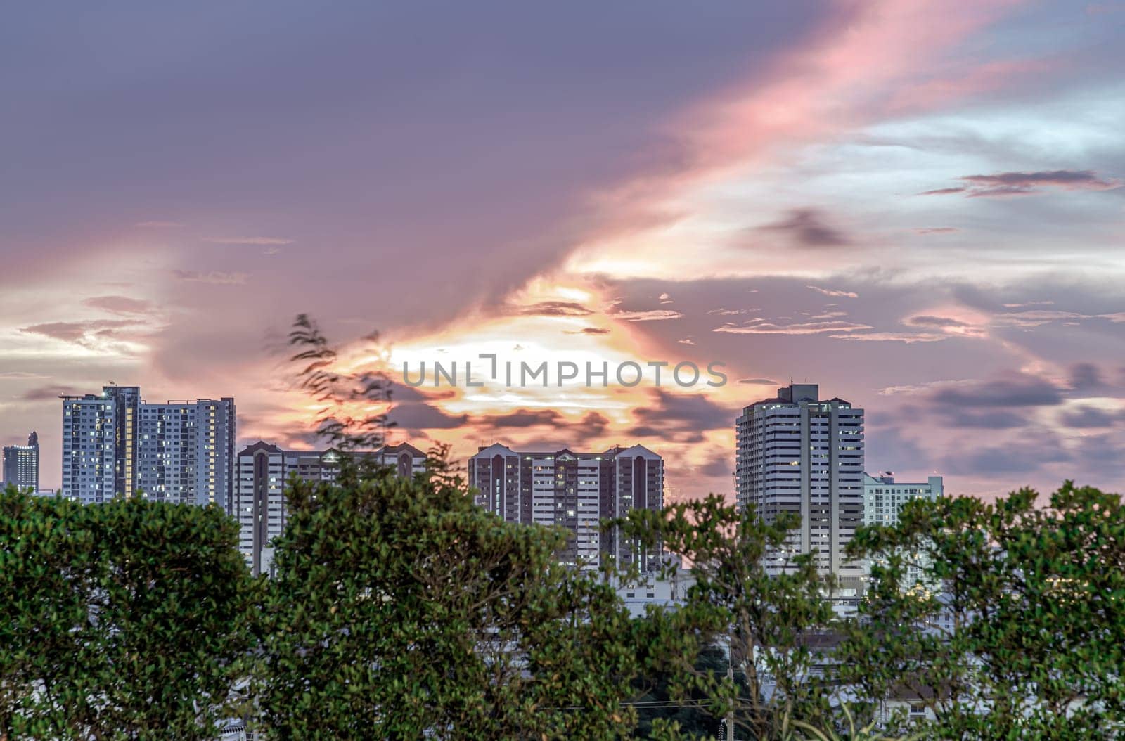 Bangkok, Thailand - May 20, 2024 - Gorgeous scenic of sunset with beautiful cloud and sky over metropolitan city. Bangkok city skyscrapers after sunset with Beautiful sky background, They can be used as Wallpaper, Copy space, Selective Focus.