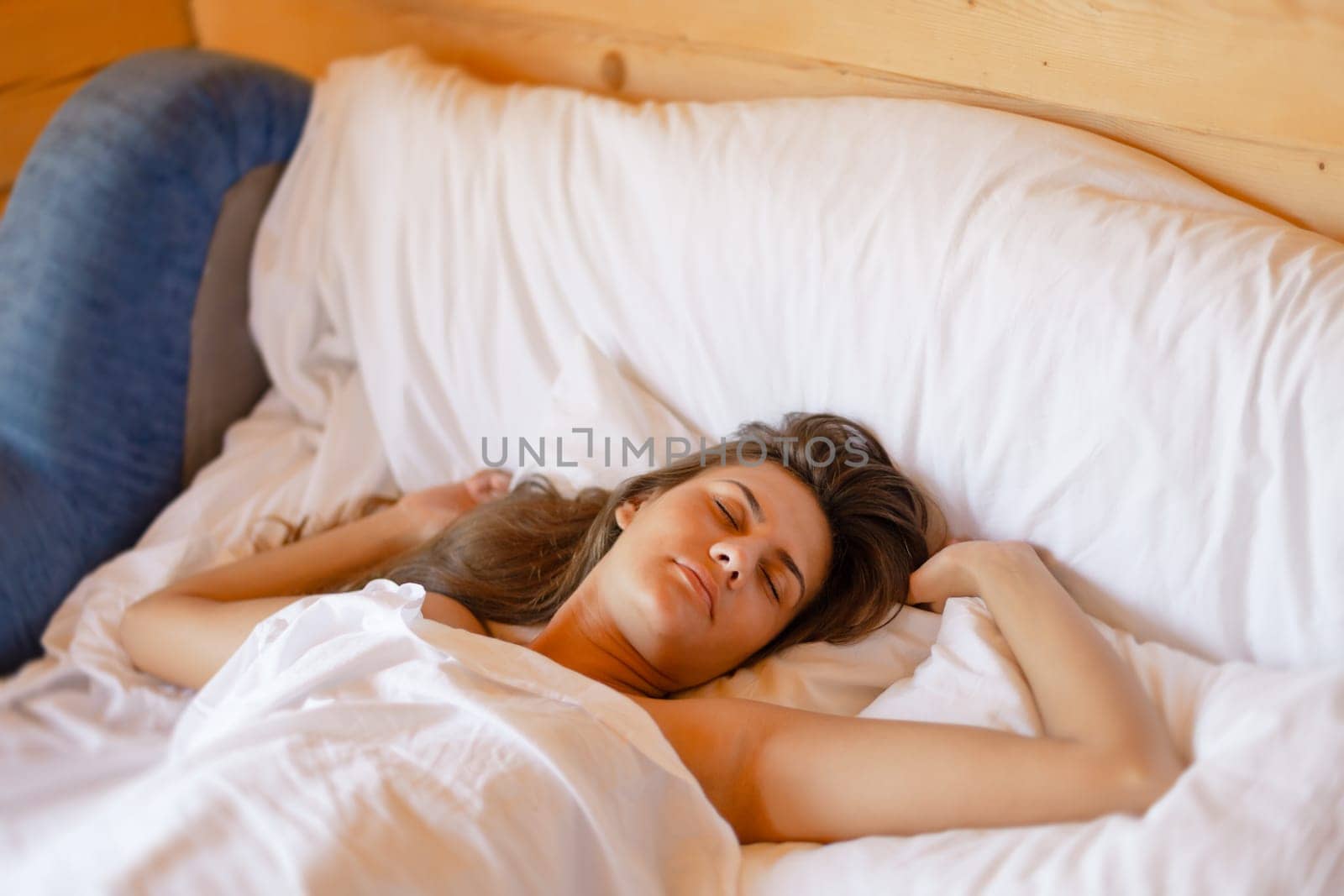Camping holiday. Portrait of a young woman sleeping in bed in the morning at a campsite