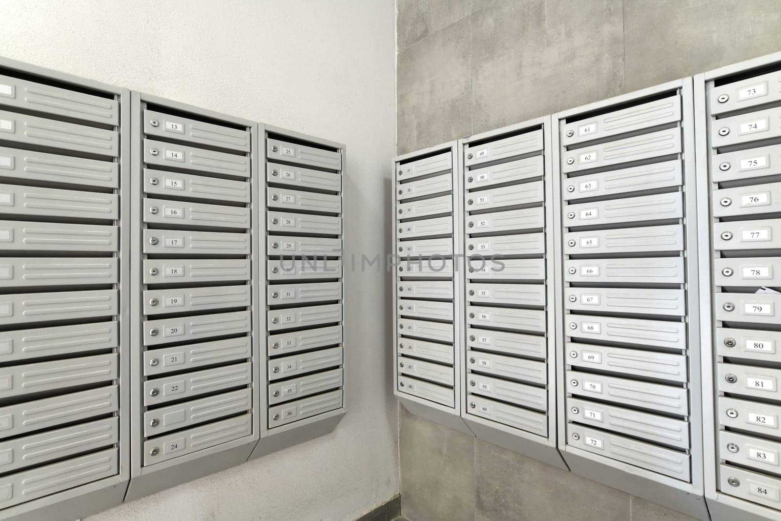 mailboxes in the interior of entrance group of residential high-rise building, Russia