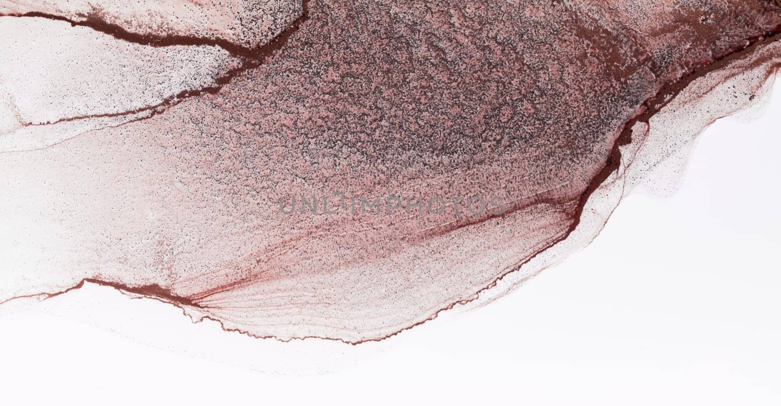 A close-up photograph of a watercolor painting with swirling strokes in shades of rose and brown. The paint appears to be layered, with lighter shades on top of darker shades.