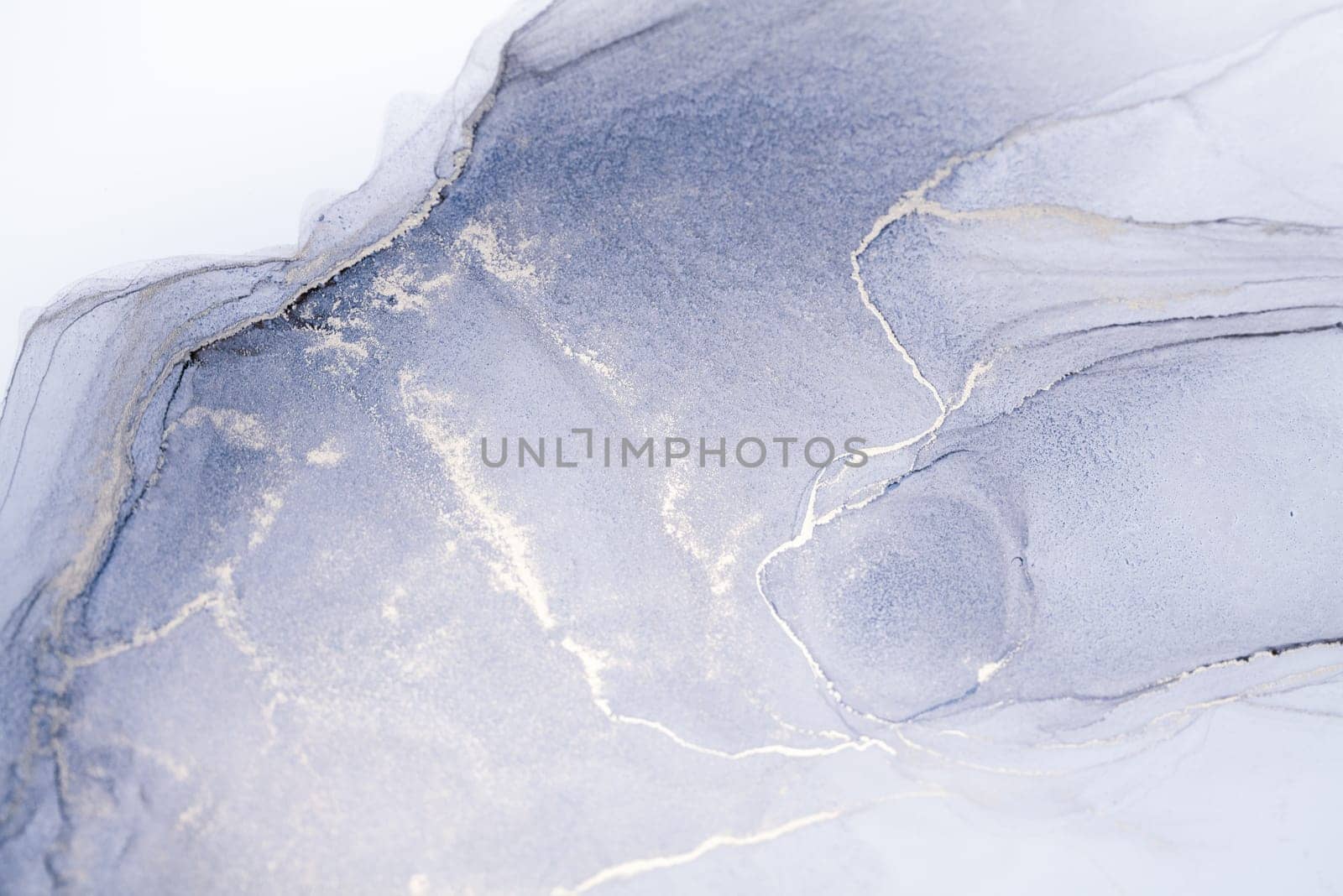 A close-up photograph of a silver and gray ink swirl abstract art piece. The ink swirls create a mesmerizing pattern, with the silver ink adding a subtle sparkle to the piece.