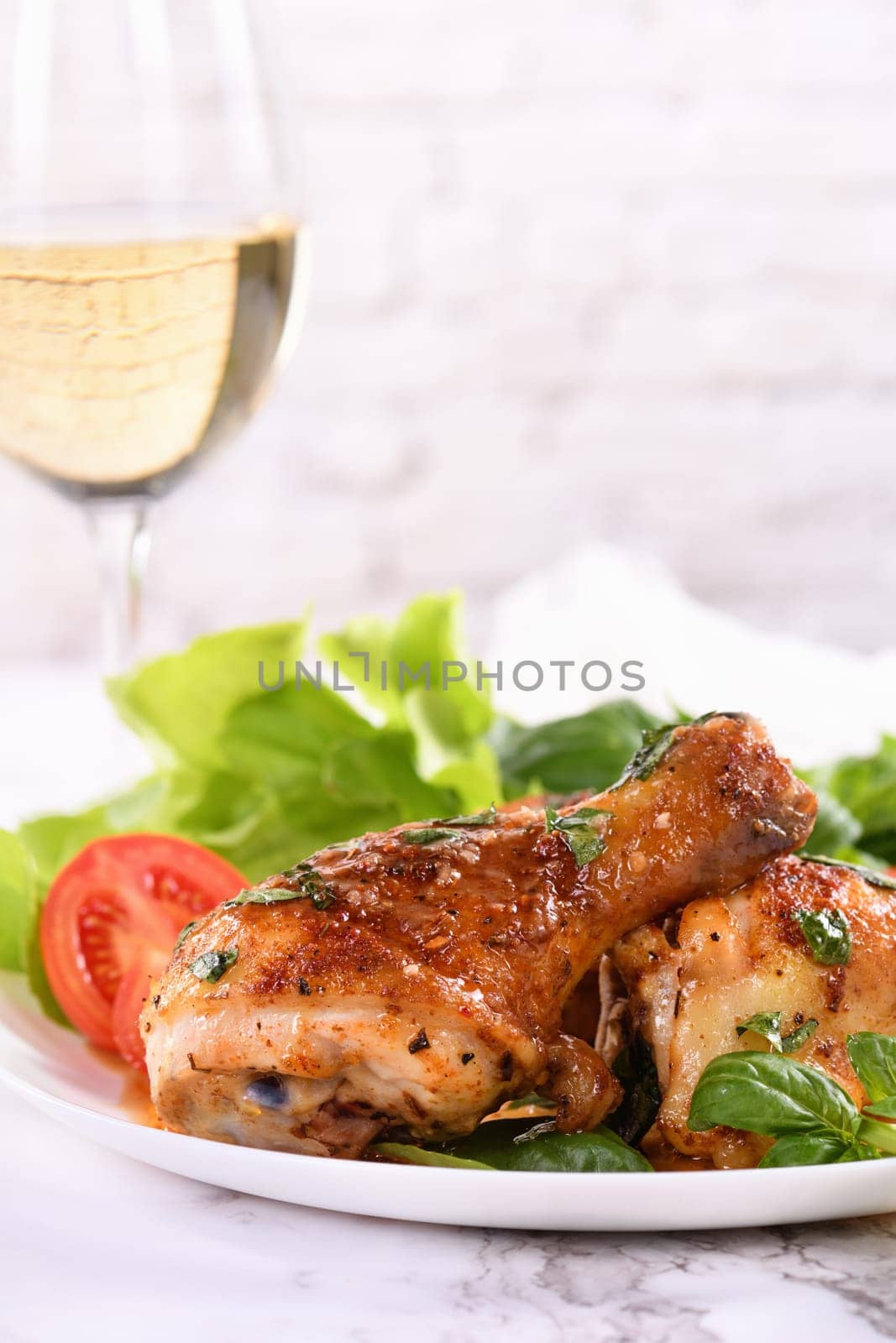 Fried chicken drumstick with gravy and vegetable side dish
