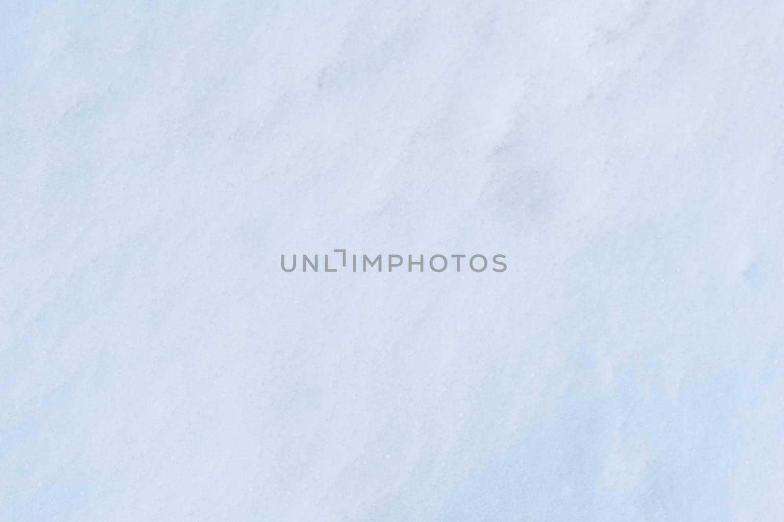 Snow surface close-up, top view. Snow texture close-up.