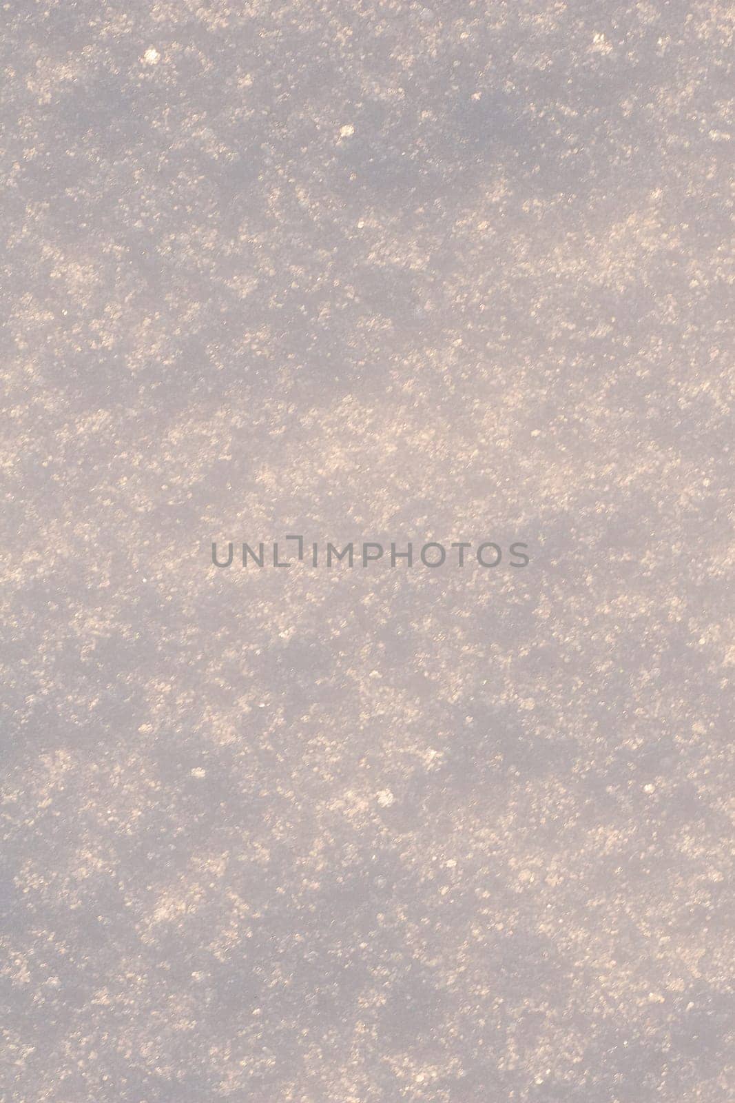 White frost snow toned in blue background.