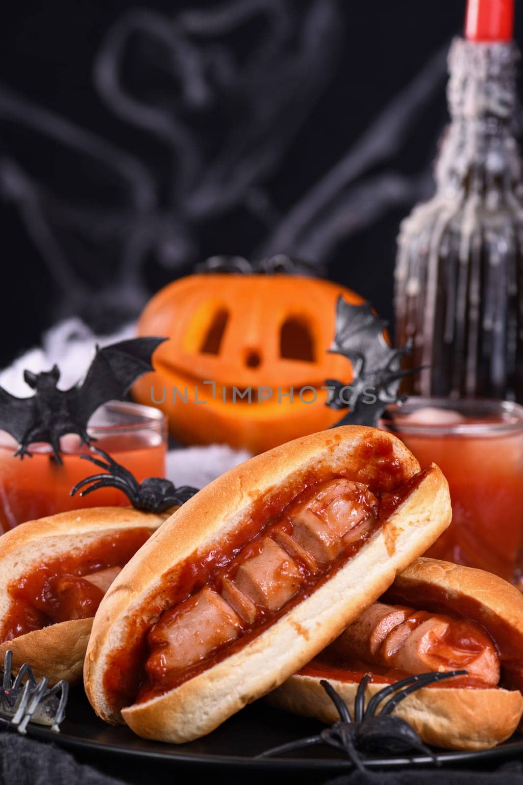 Plate of hot dogs Bloody fingers on a Halloween table