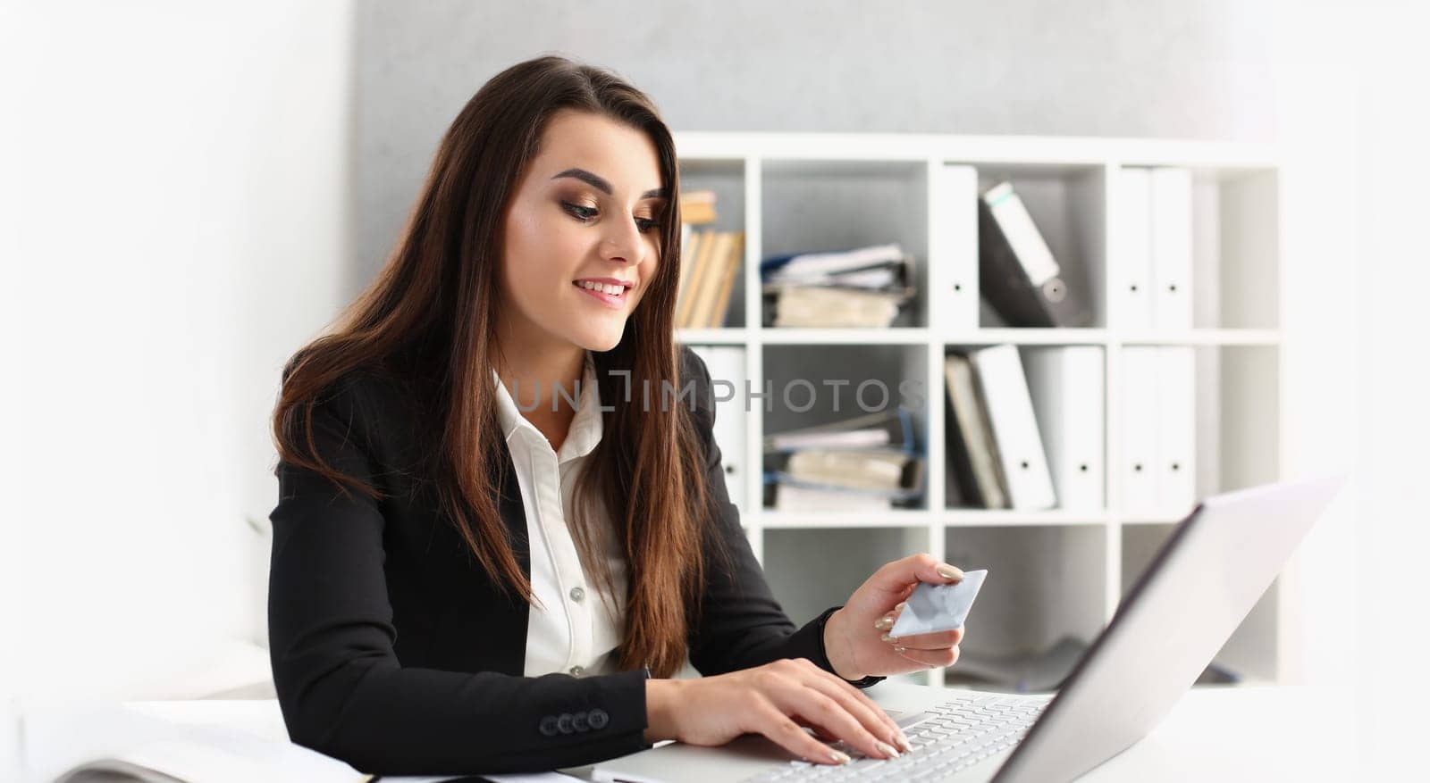 Portrait of woman type on keyboard credit card pin code, pay online, shopping on laptop from work. Online shopping, contactless payment, technology concept