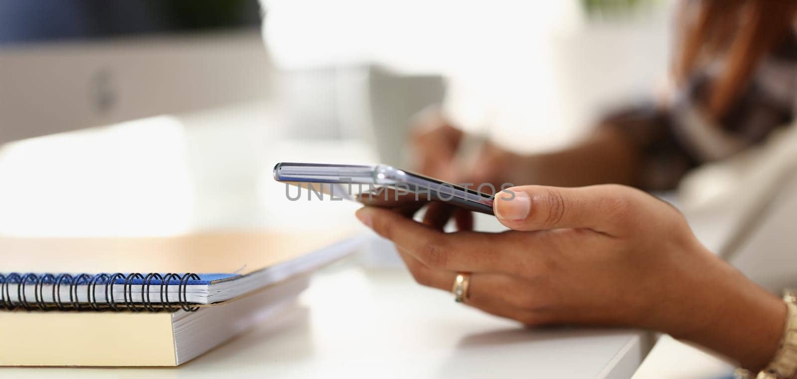 Close-up of womans hand hold mobile phone device, gadget for communication, send message, call. Modern technology, addiction, connection, kill time concept