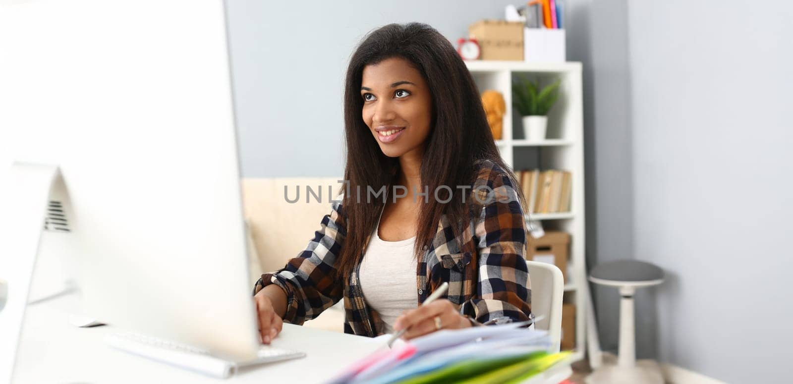 Portrait of smiling afro american woman on workplace, work as secretary, student on remote education. Job, career, education, knowledge, freelancer concept