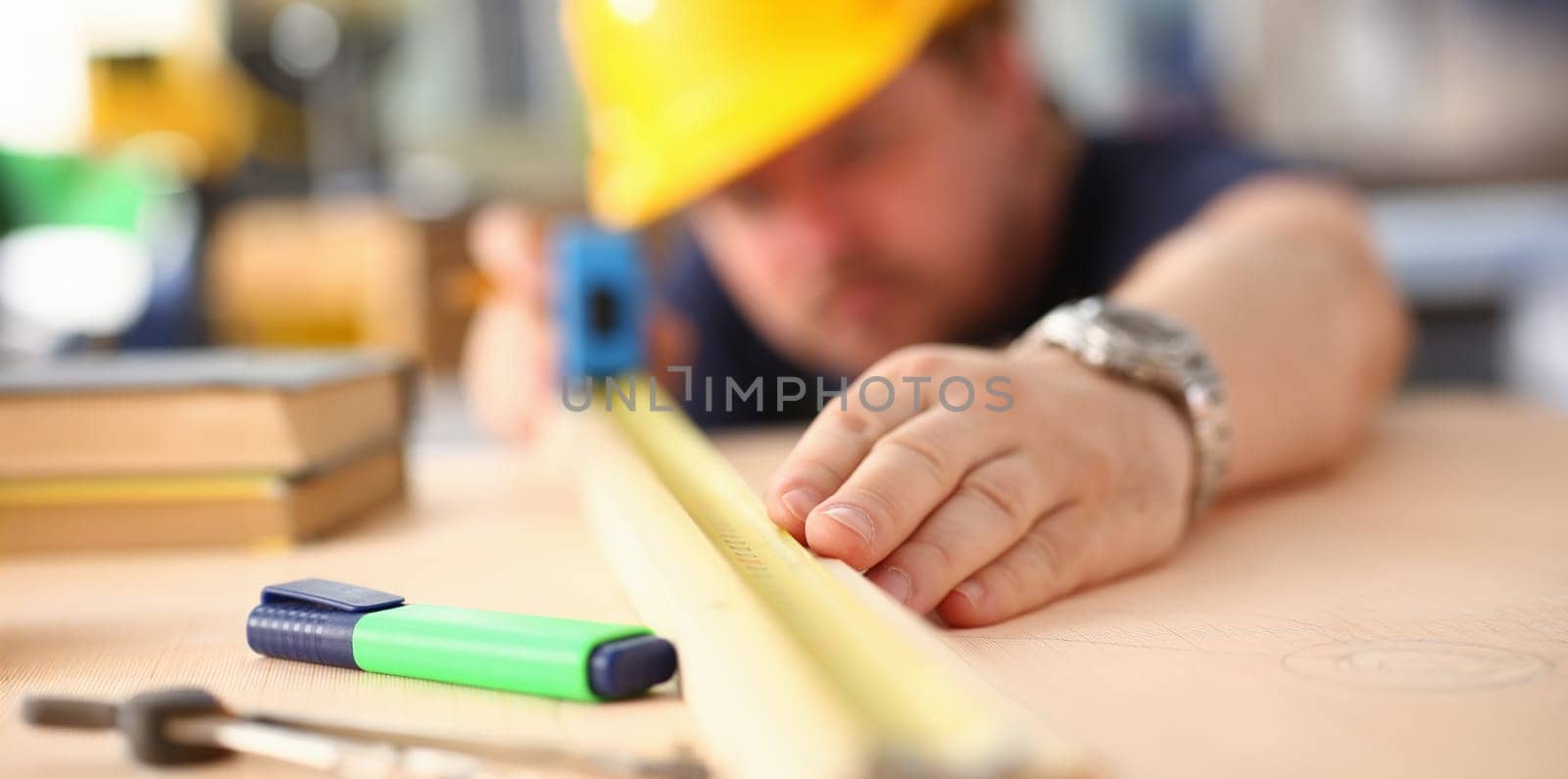 Close-up of male measuring wooden bar with equipment, manual job, diy inspiration. Joinery startup, designer career, renovation, building, project concept