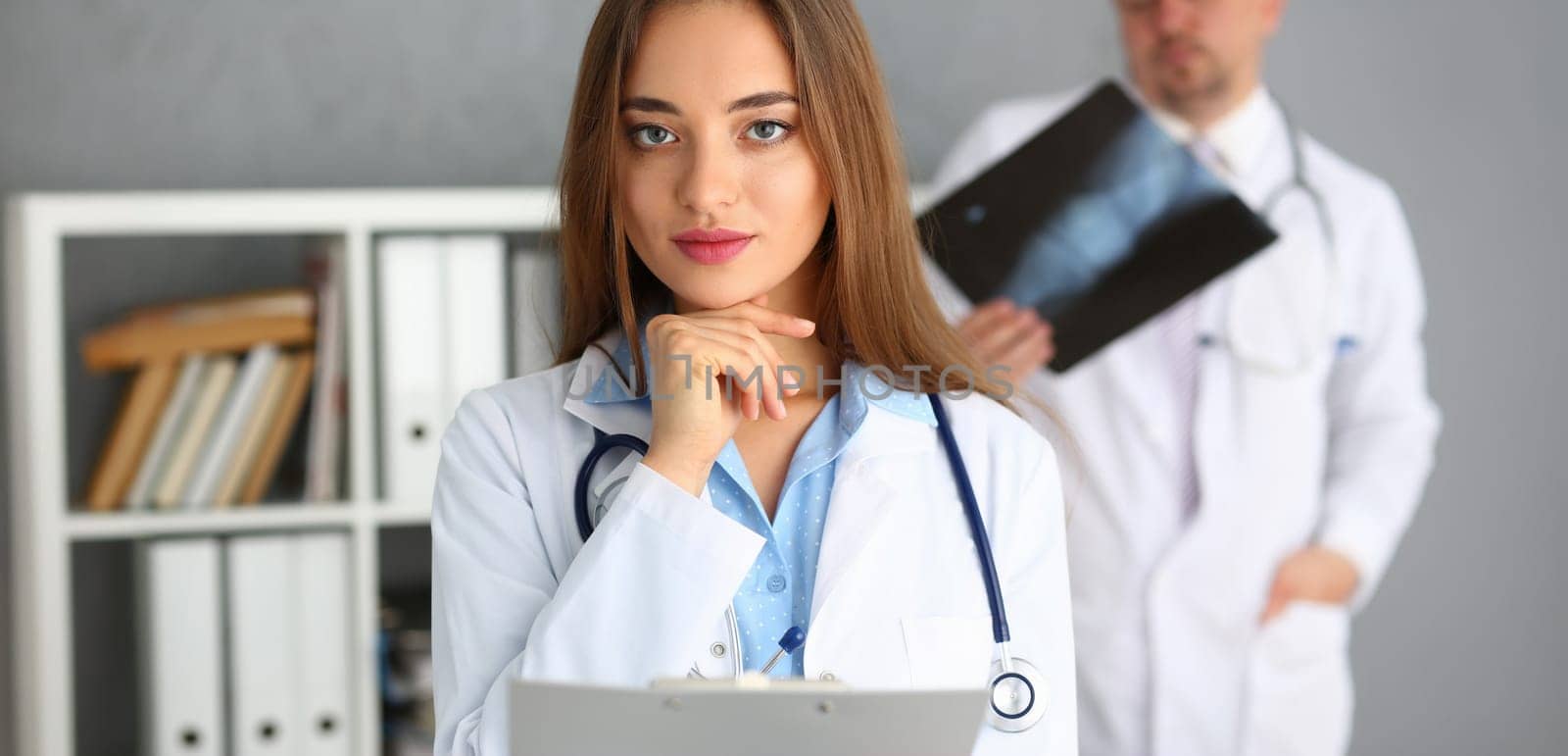 Portrait of qualified doctor in gown, young medical specialist, begin to work in clinic. Healthcare, medicine, emergency, save life, help, hospital concept