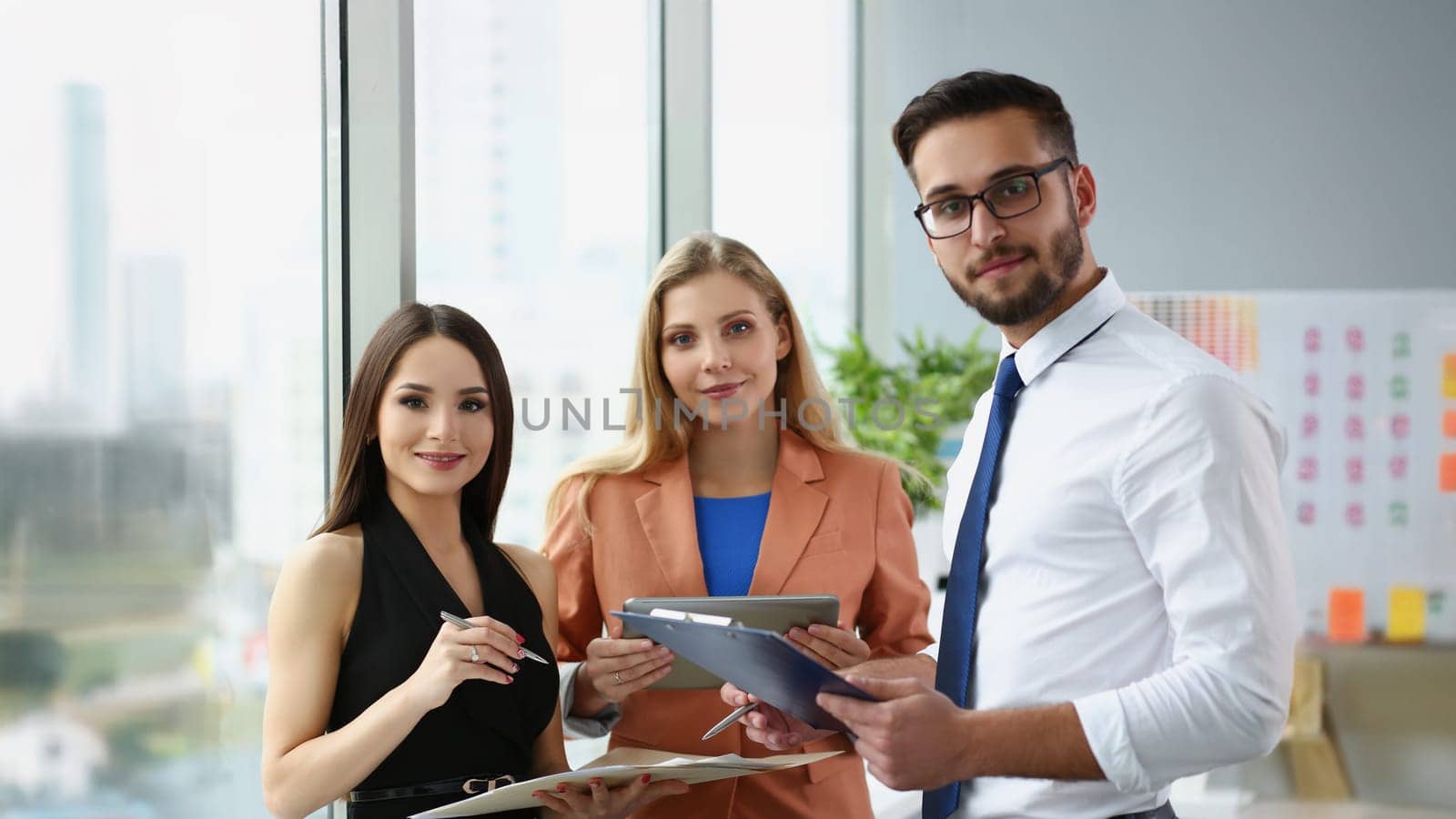Portrait of confident team of successful people, men and women employees pose for collective picture. Coworkers in trendy suits. Business, teamwork concept