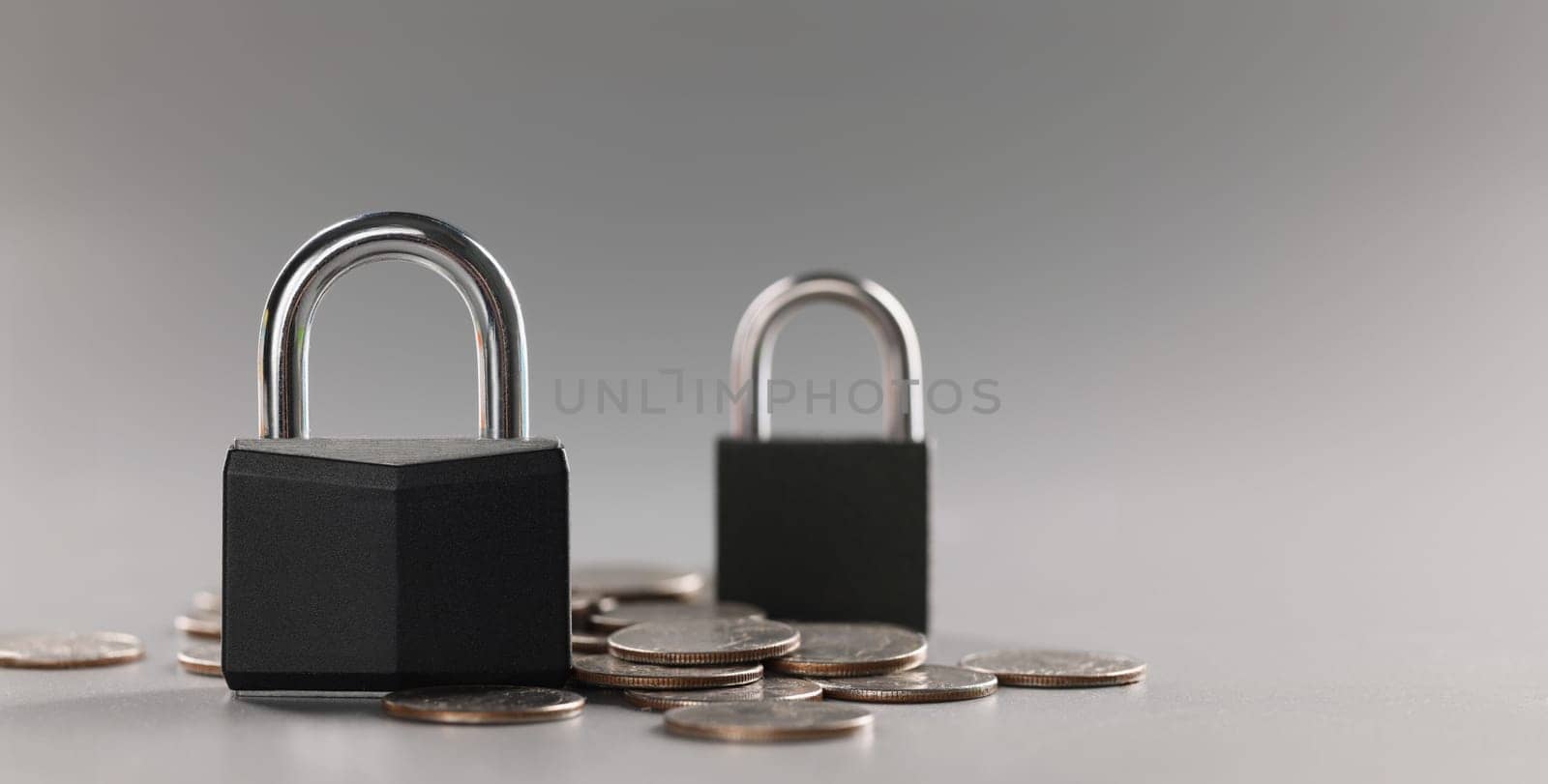 Close-up of combination padlock on coin money for financial security, symbol for protection finance. Keep savings in secure place. Security, safety concept