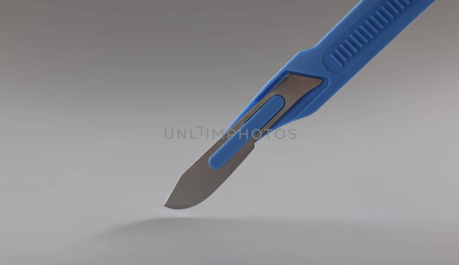 Close-up of retractable pocket sized box cutter blue colour knife, sharp equipment. Household box cutter instrument for general or utility purposes concept