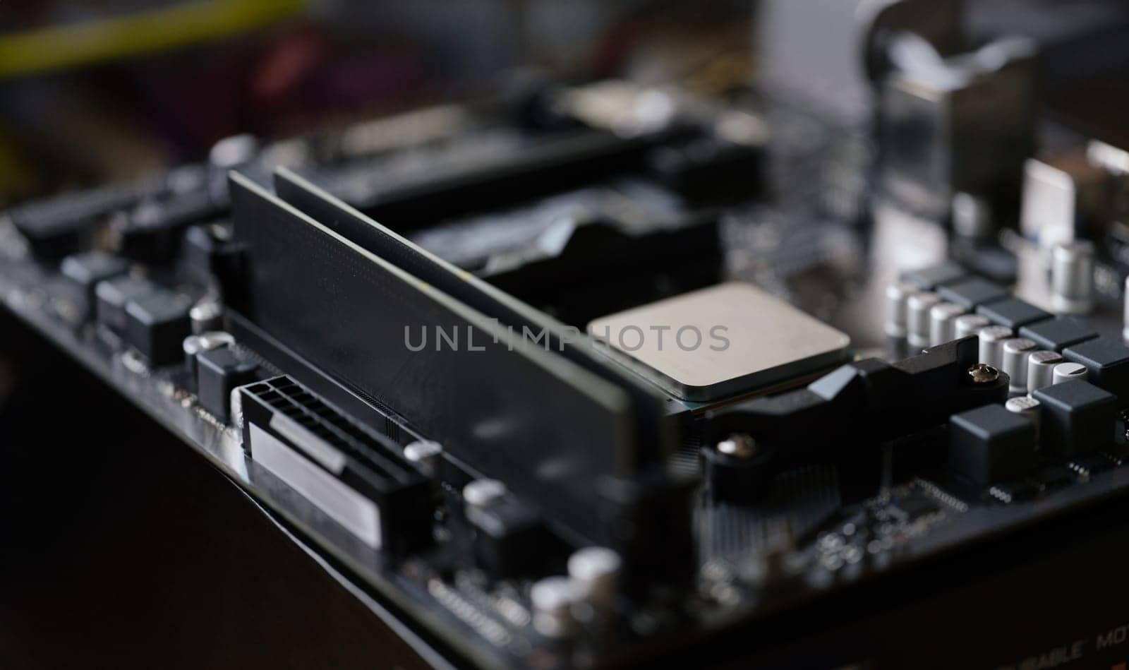 Close-up of tiny silver detail in computer processor, computer motherboard with all component. Modern technology, tech, electronics, maintenance concept