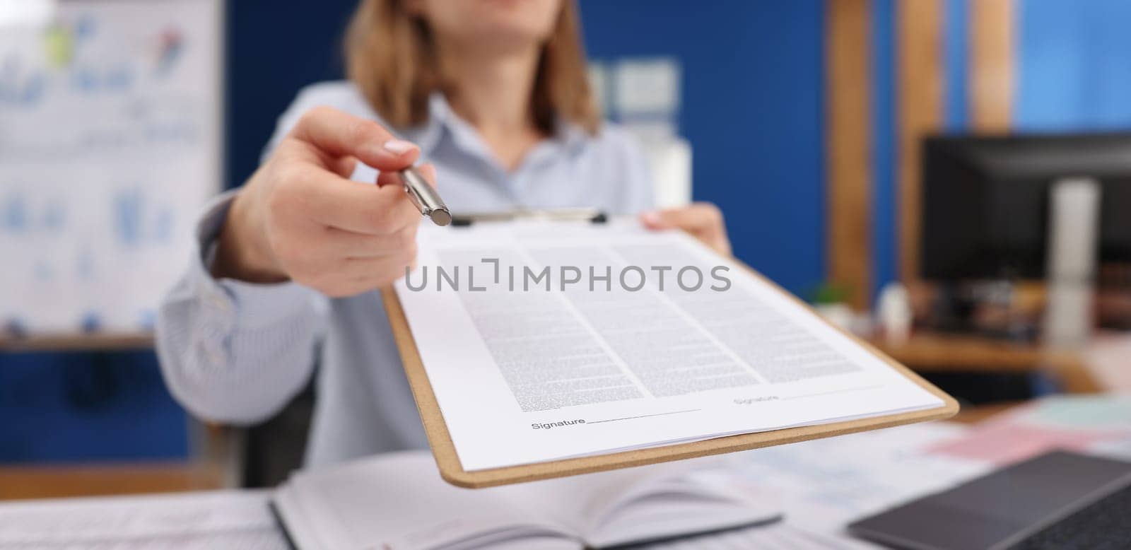 Close-up of businesswoman give silver pen to client to put signature on contract paper. Prepared business document for client. Business, agreement concept