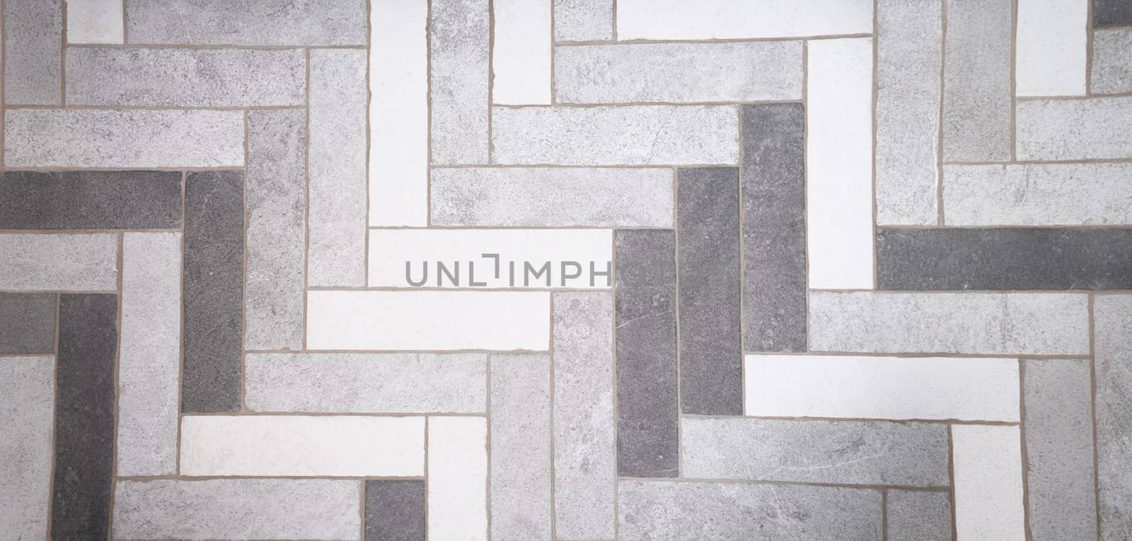 Top view of seamless black white and grey mosaic marble floor tile texture in geometric shape pattern. Monochrome tone design. Interior concept. Copy space