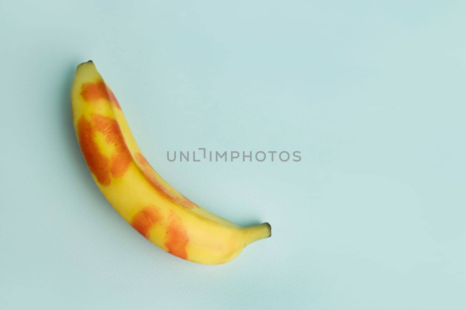 Blow job . A banana decorated with traces of red lipstick. Oral Sex and Concept.