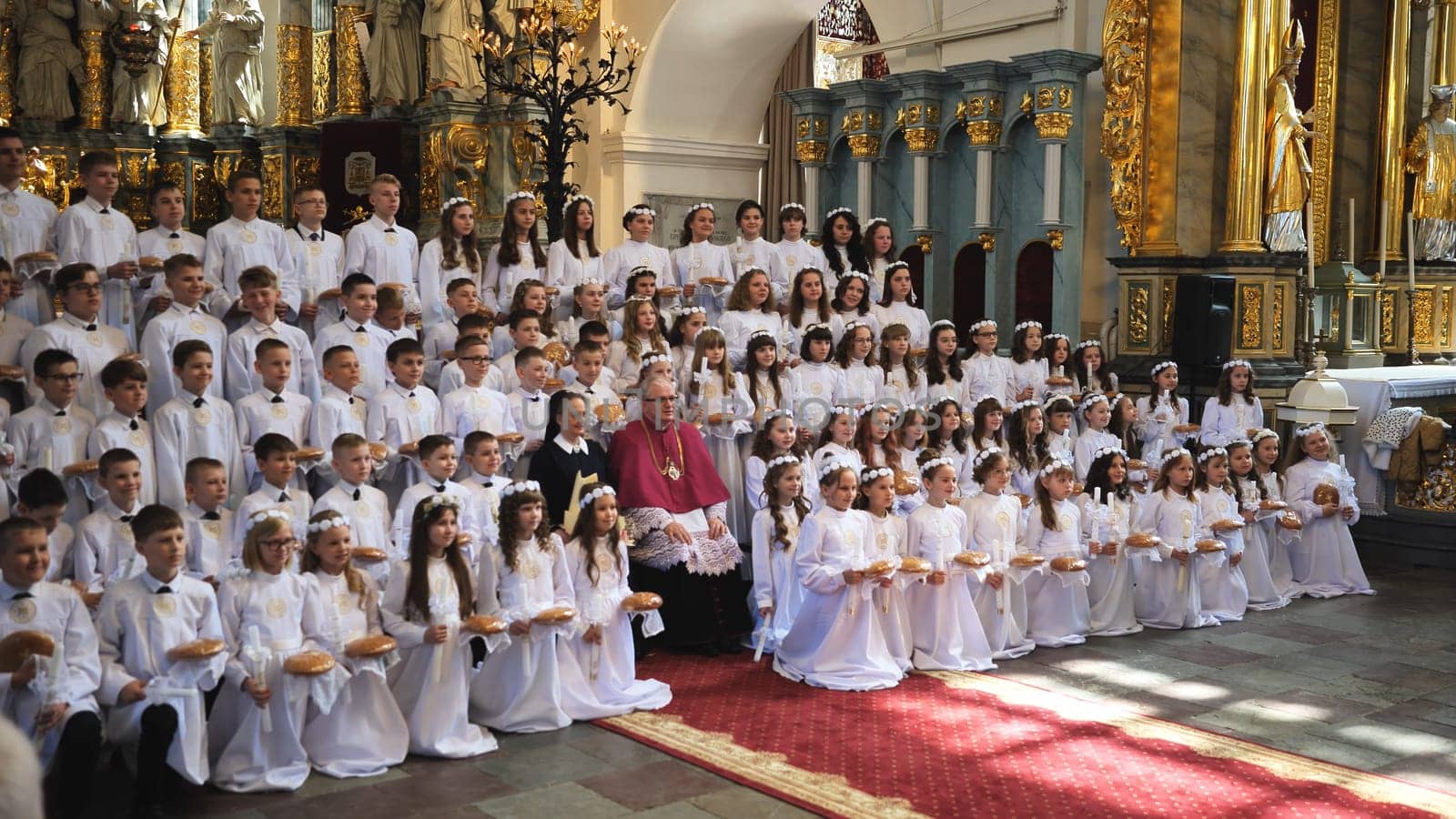 30.05.23 Vinnitsa, Ukraine: the holiday of the first communion and solemn liturgy in the Catholic church where many children receive their first communion