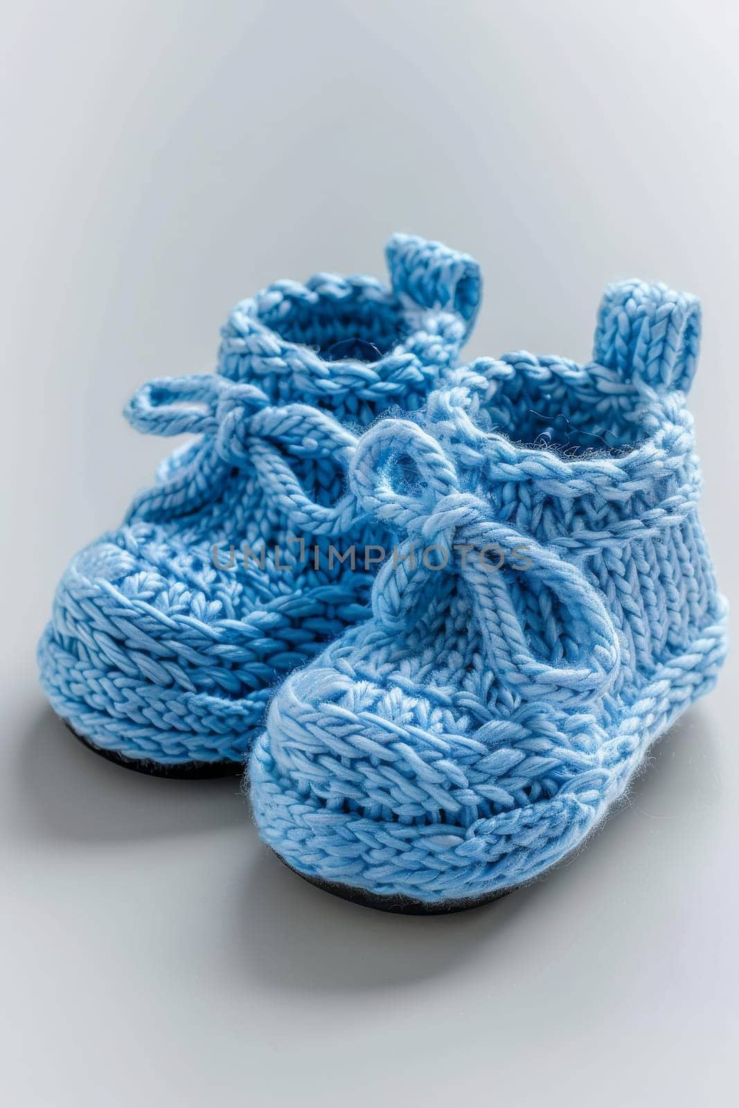 baby booties on a white background. Generative AI,