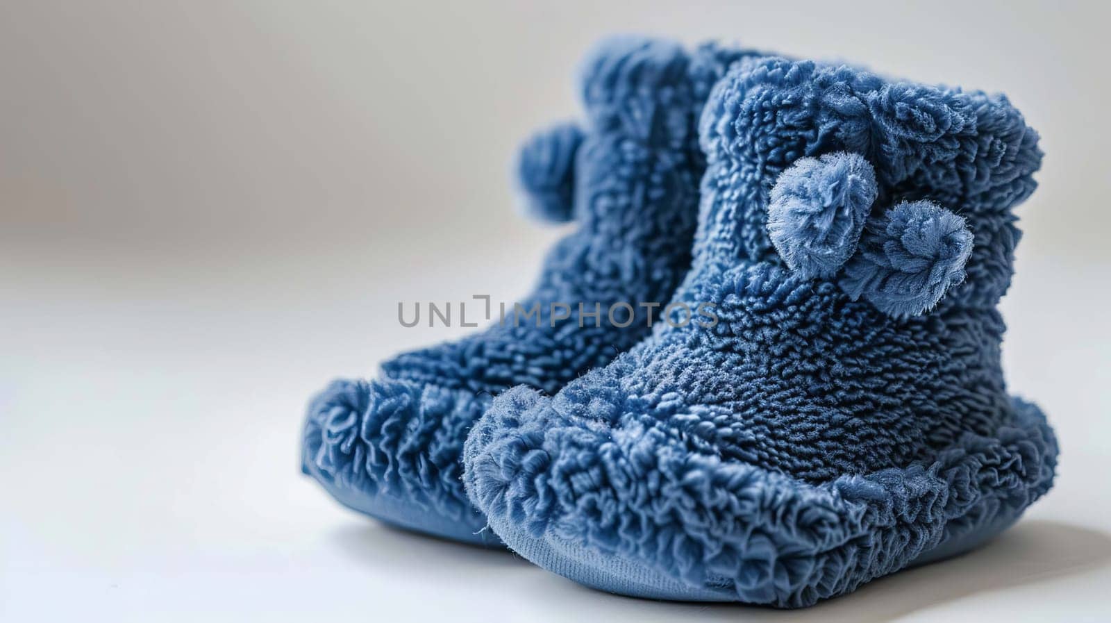 baby booties on a white background. Selective focus. Generative AI,