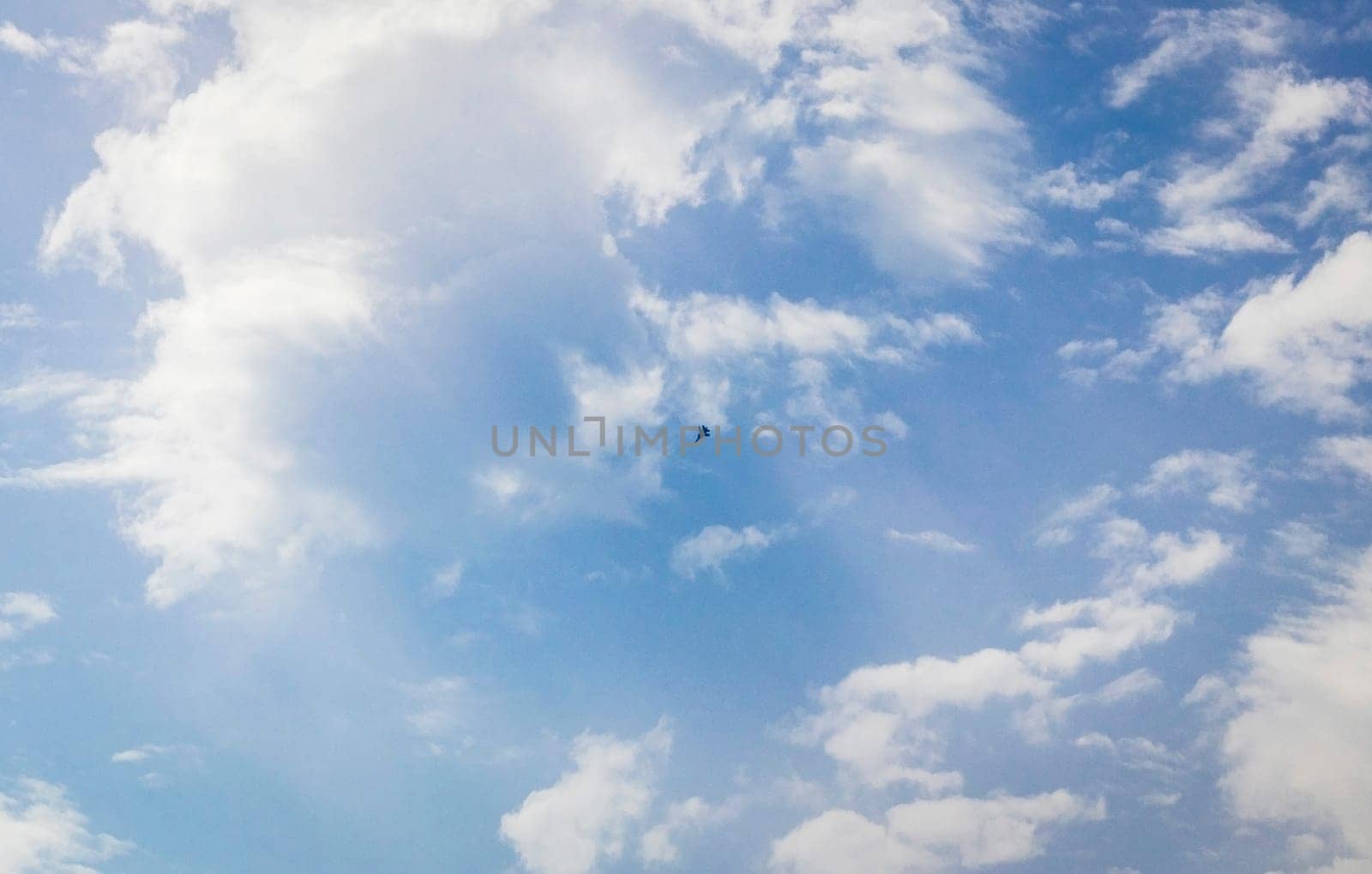 Silhouette of the MIG fighter jet in the cloudy sky