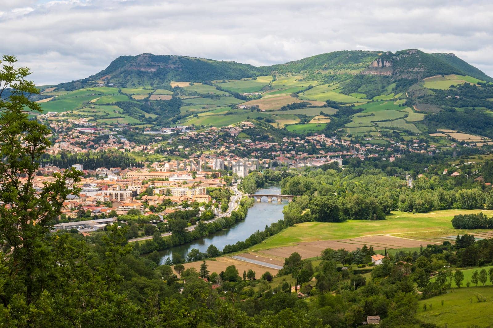 View over Millau town with Causse du Larzac limestone plateau, listed as UNESCO World Heritage Site. Department of Aveyron, France