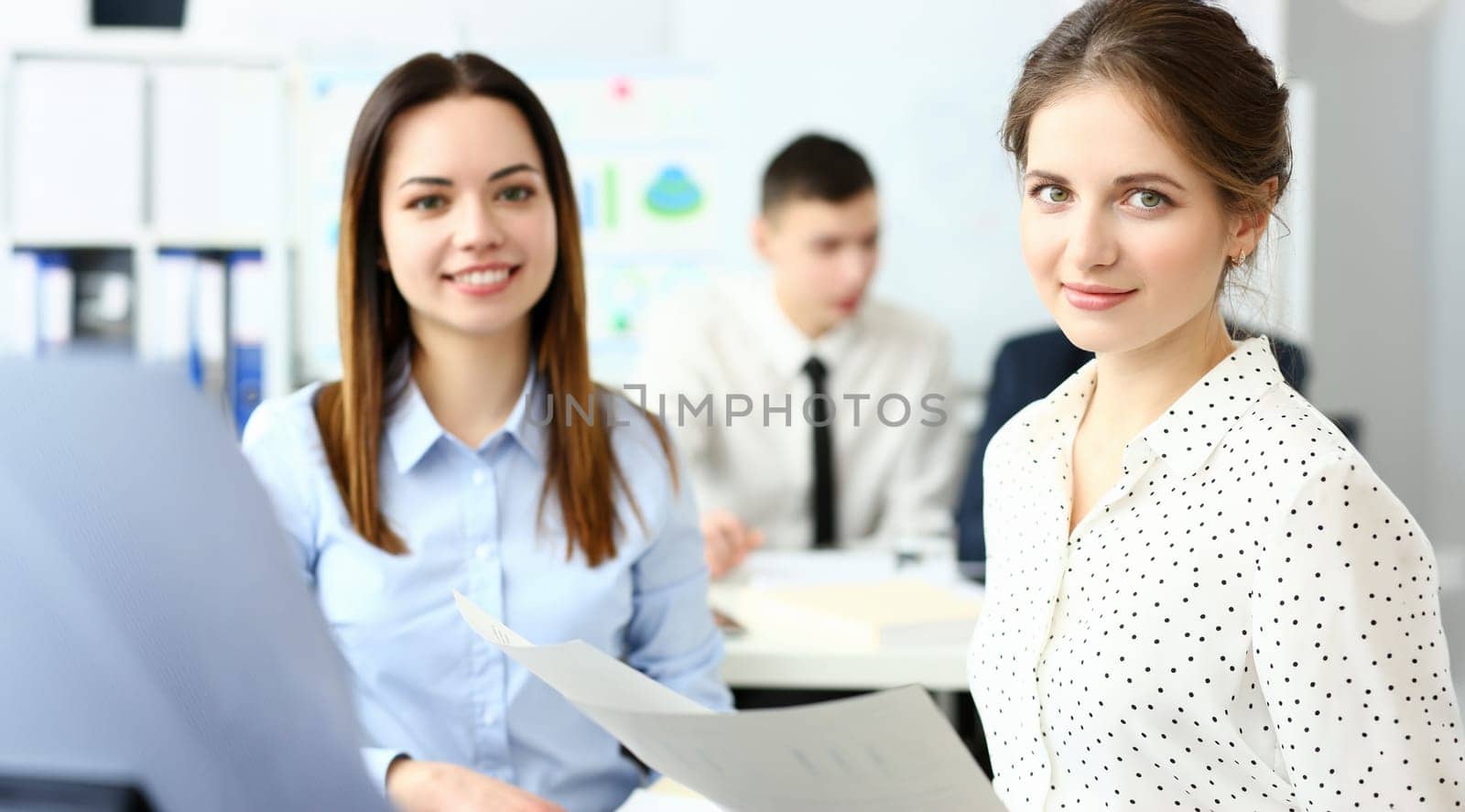 Group of modern businesspeople in office debate on financial issue hold in arms documents portrait. Success assessment human resources data analysis person