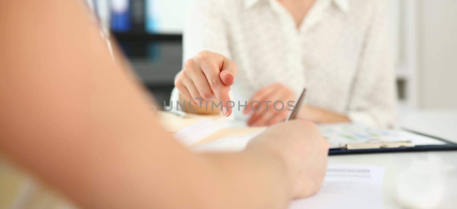 Female arm offer contract form touch finger to sign closeup. Strike bargain for profit white collar motivation union decision corporate executive sale insurance agent concept