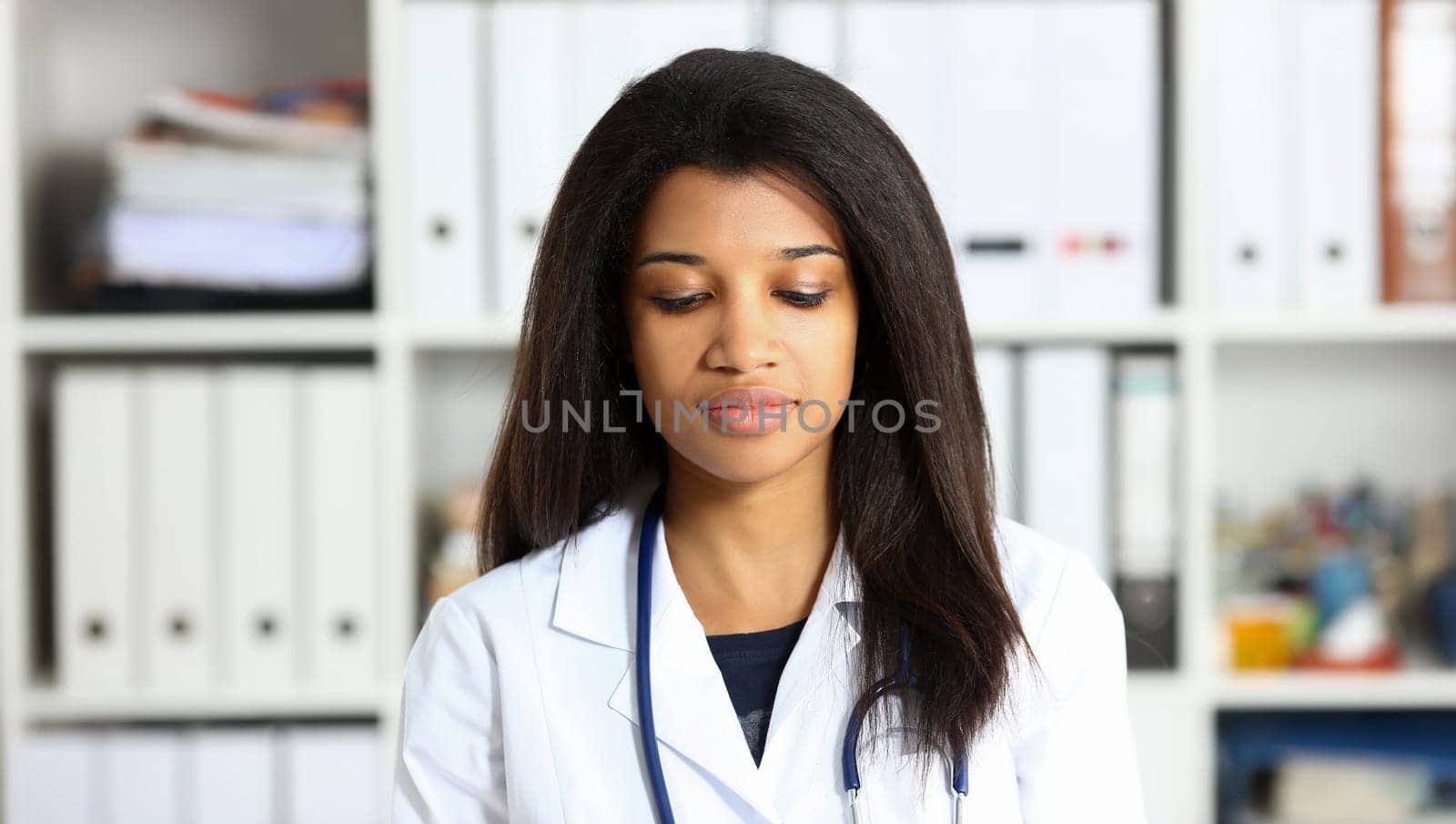 Beautiful black smiling female doctor at workplace portrait. Physical and disease prevention patient aid exam visit ward round, prescribe remedy healthy lifestyle consultant profession concept